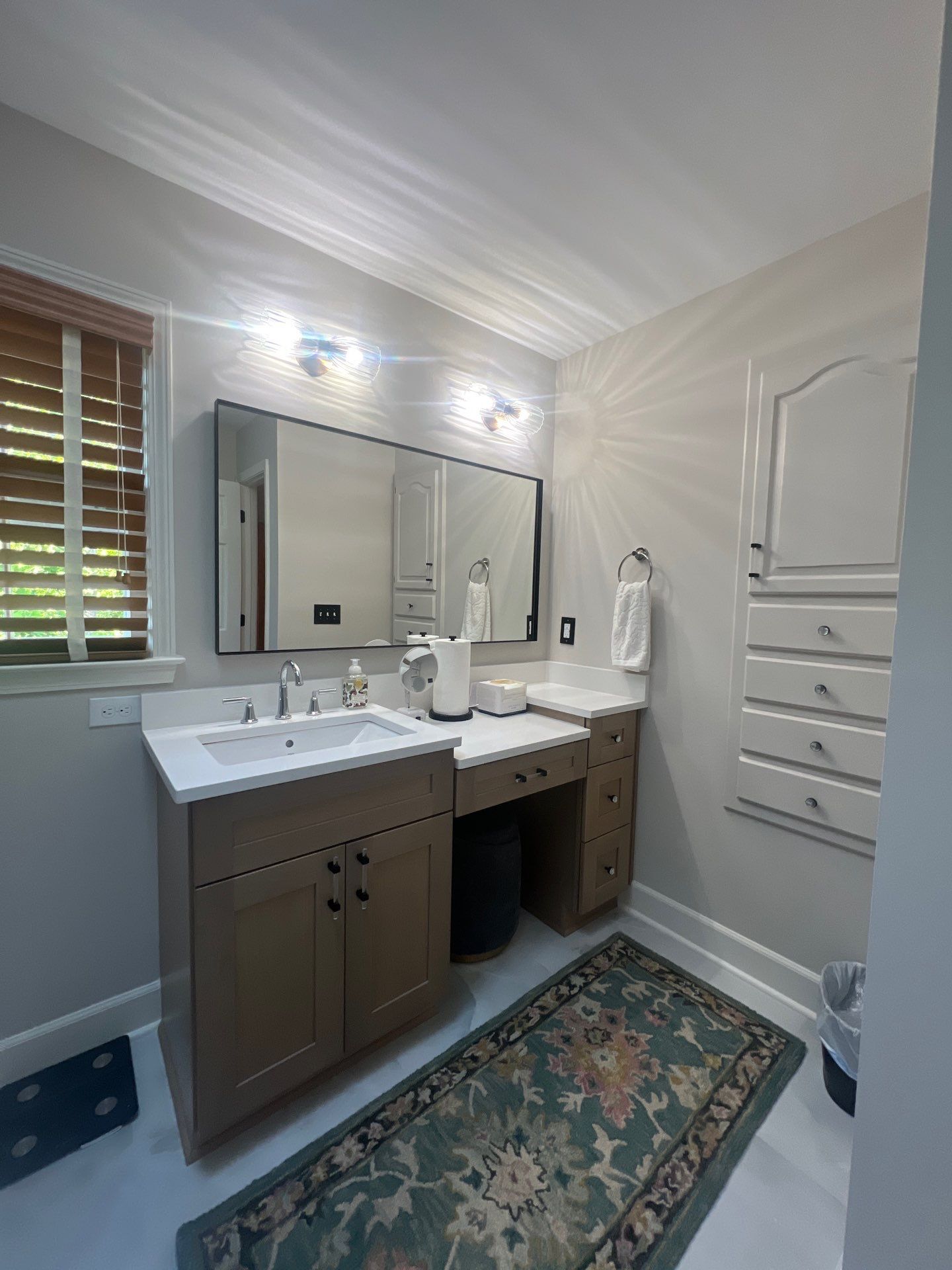 Modern Bathroom Remodeling Featuring Marble Tiles and Custom Cabinetry in Smyrna by Swift Home Renovations