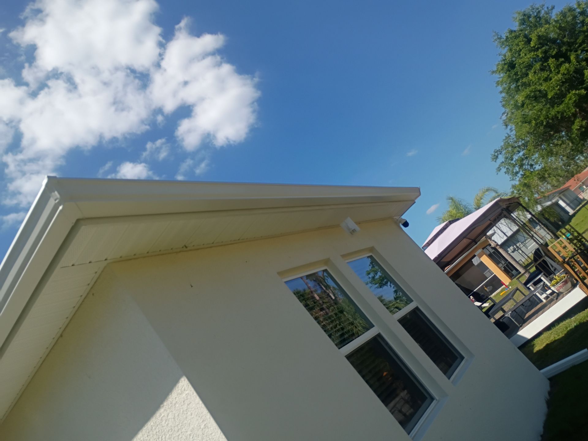 6-inch K-style White Seamless Gutters with Downspouts in North Port, FL by Gutter Professors