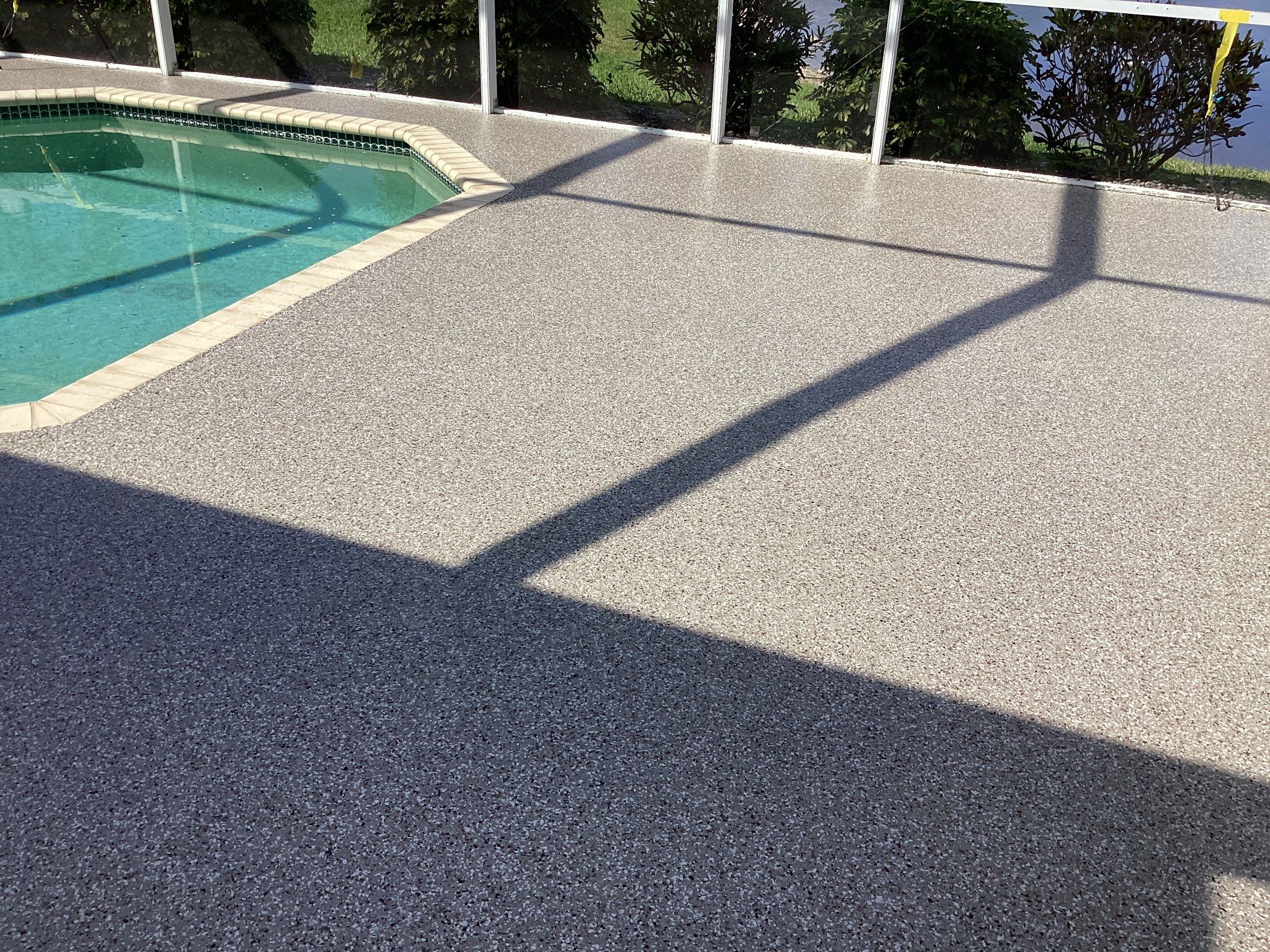 Patio using Pebble Beach by Amvet concrete coatings llc