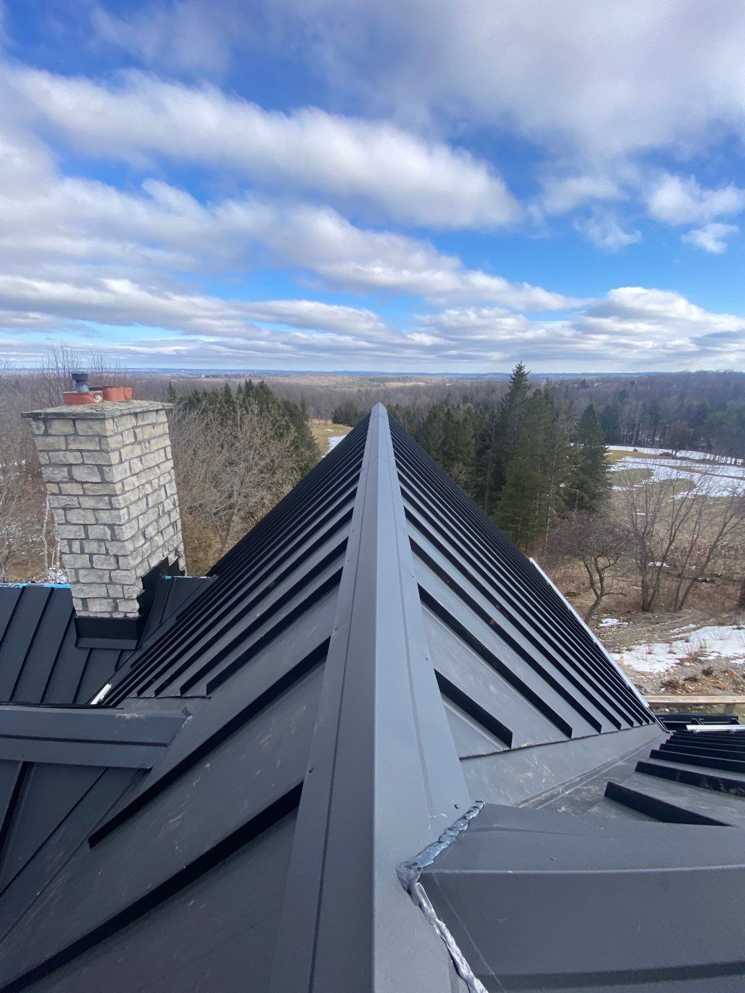 Residential Roofing Installation using 24 Ga Standing Seam Metal by Jay Carter Roofing & Sheet Metal