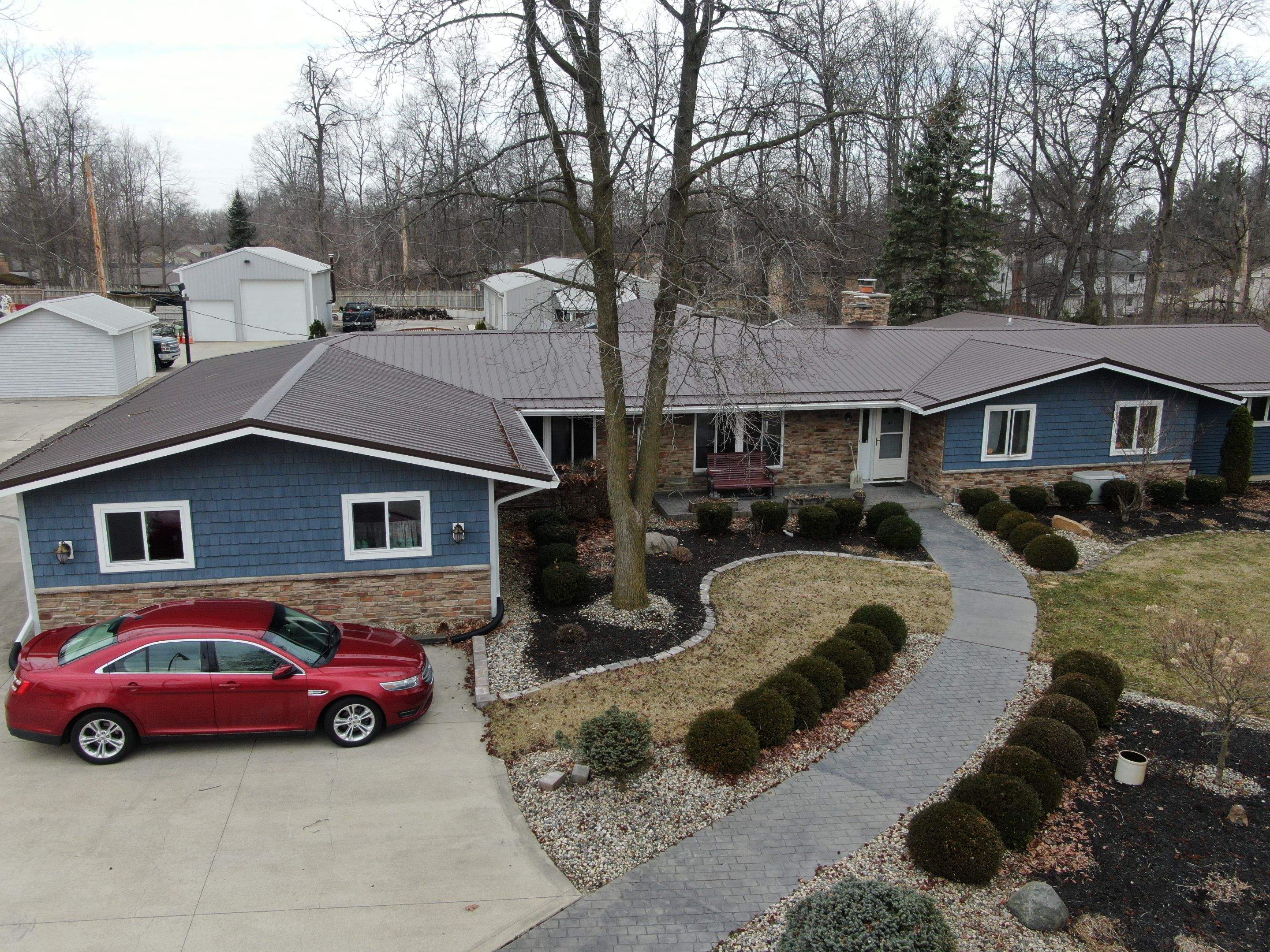 Residential Roofing Installation using Exposed Fastener Metal Roof by 4Ever Metal Roofing