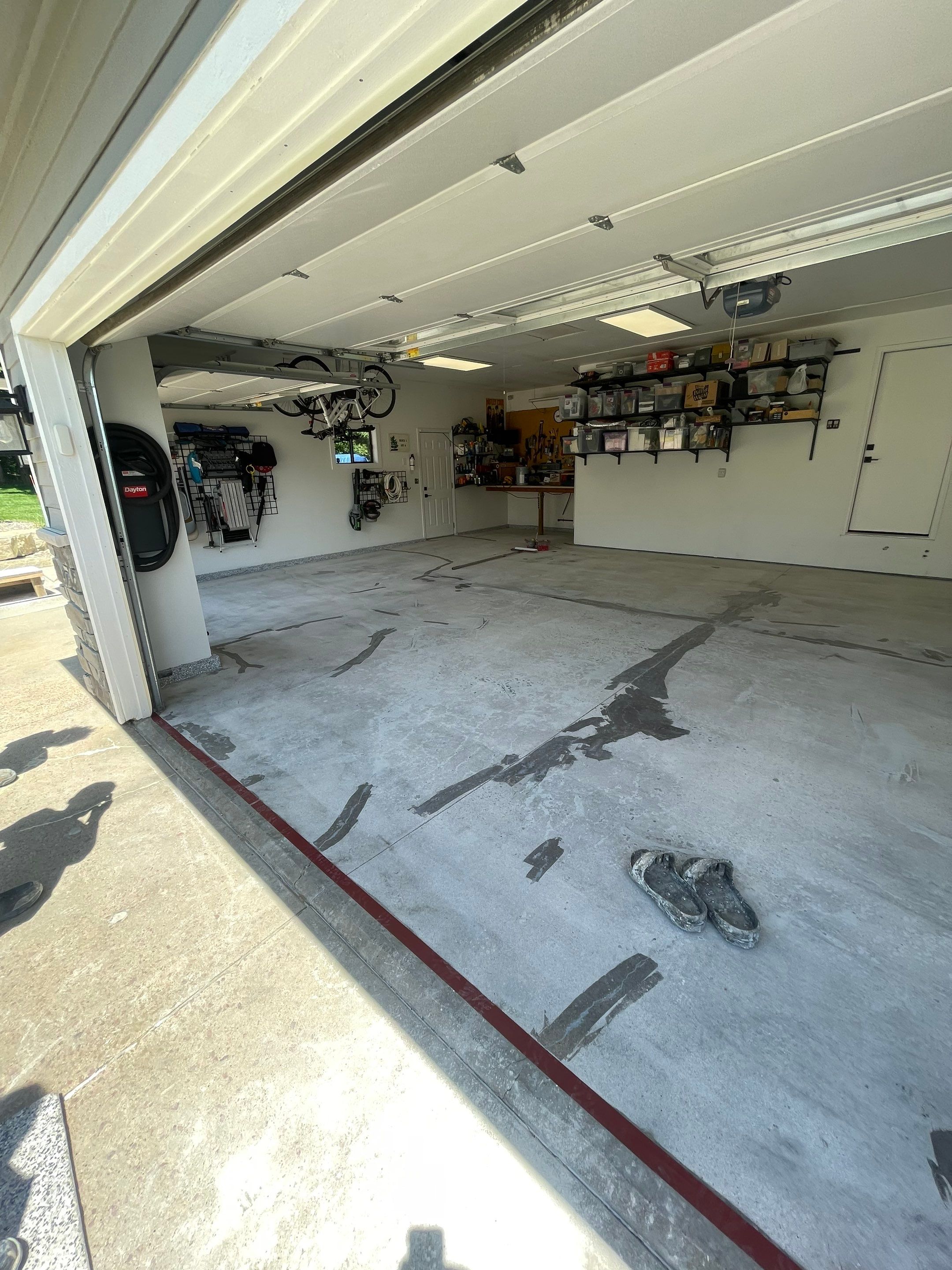 Feather Grey Garage Floor Coating Installation in Sioux Falls by Select Painting, Coatings & Garage Cabinets
