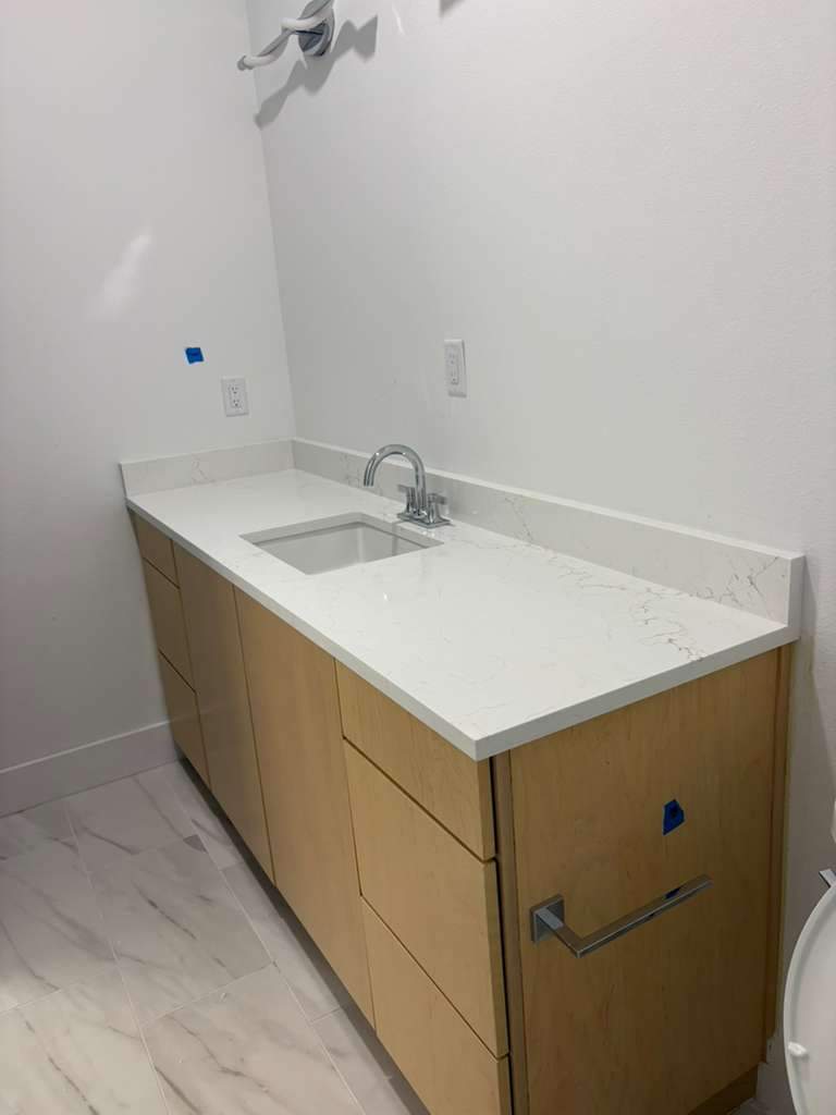 A home with a mix of quartz options by Mena stone surfaces