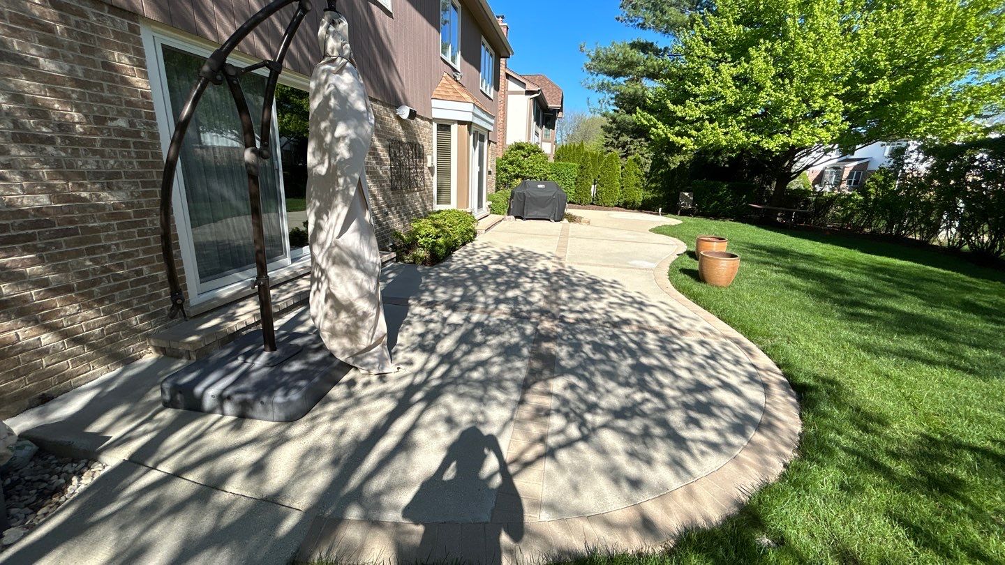 concrete patio and driveway cleaning by Northern Power Washing LLC.