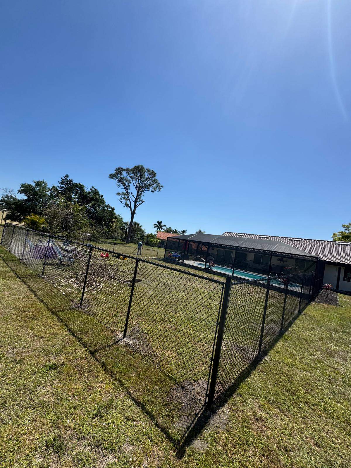 Black Chain Link Residential Backyard Fence Installation in North Port by True Fence LLC