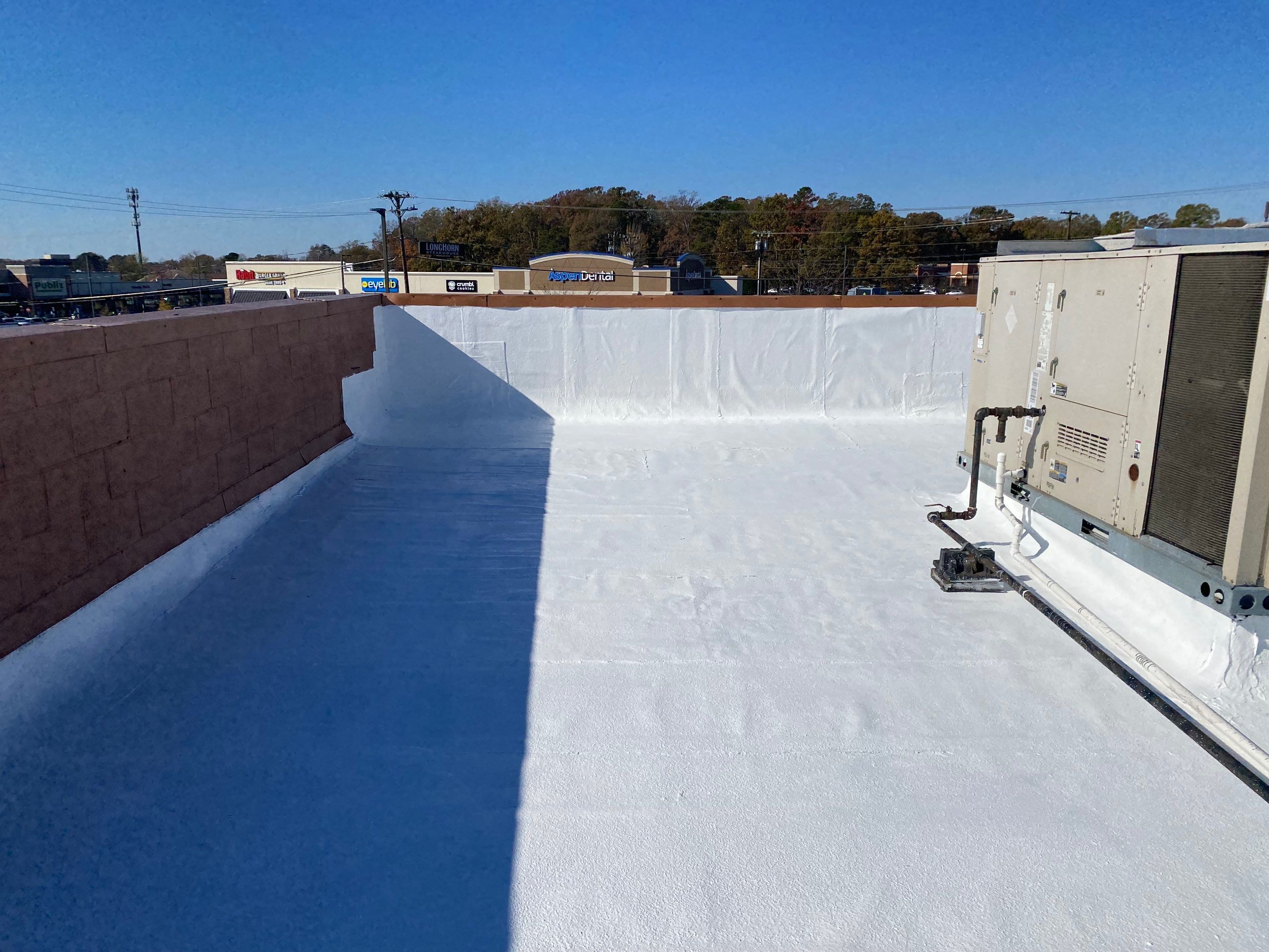 Commercial Coating using Poly Urerthane and Silicone Coating by Just In Time Roofing and Restoration