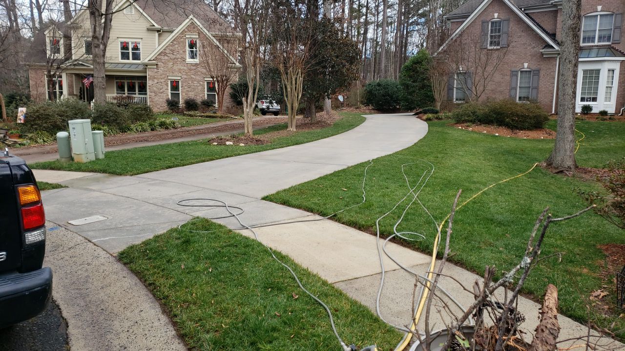 Driveway Clean using cleaner by Power Wash Masters LLC