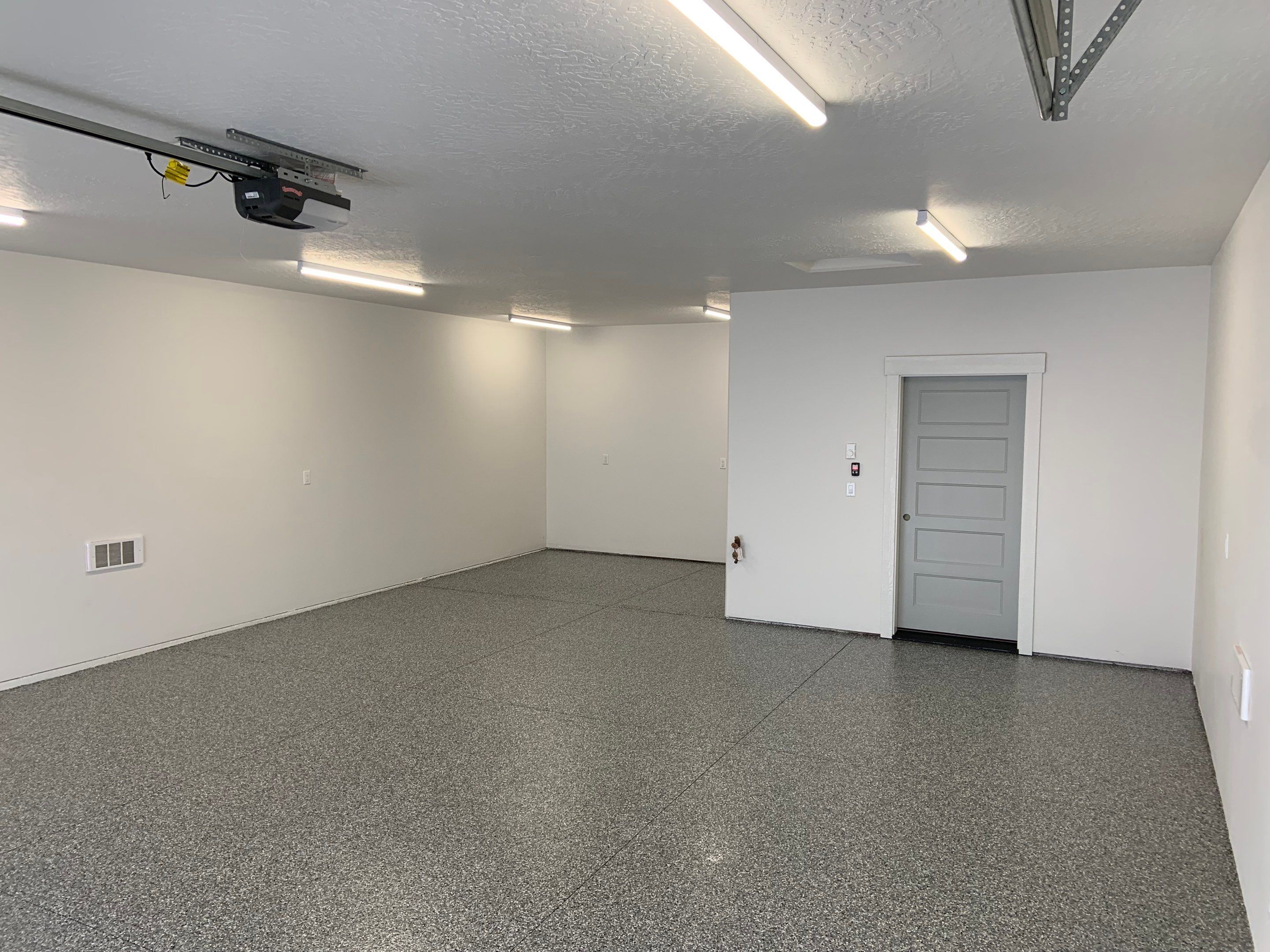 Garage Transformation using Smoke by Croc Coatings, LLC