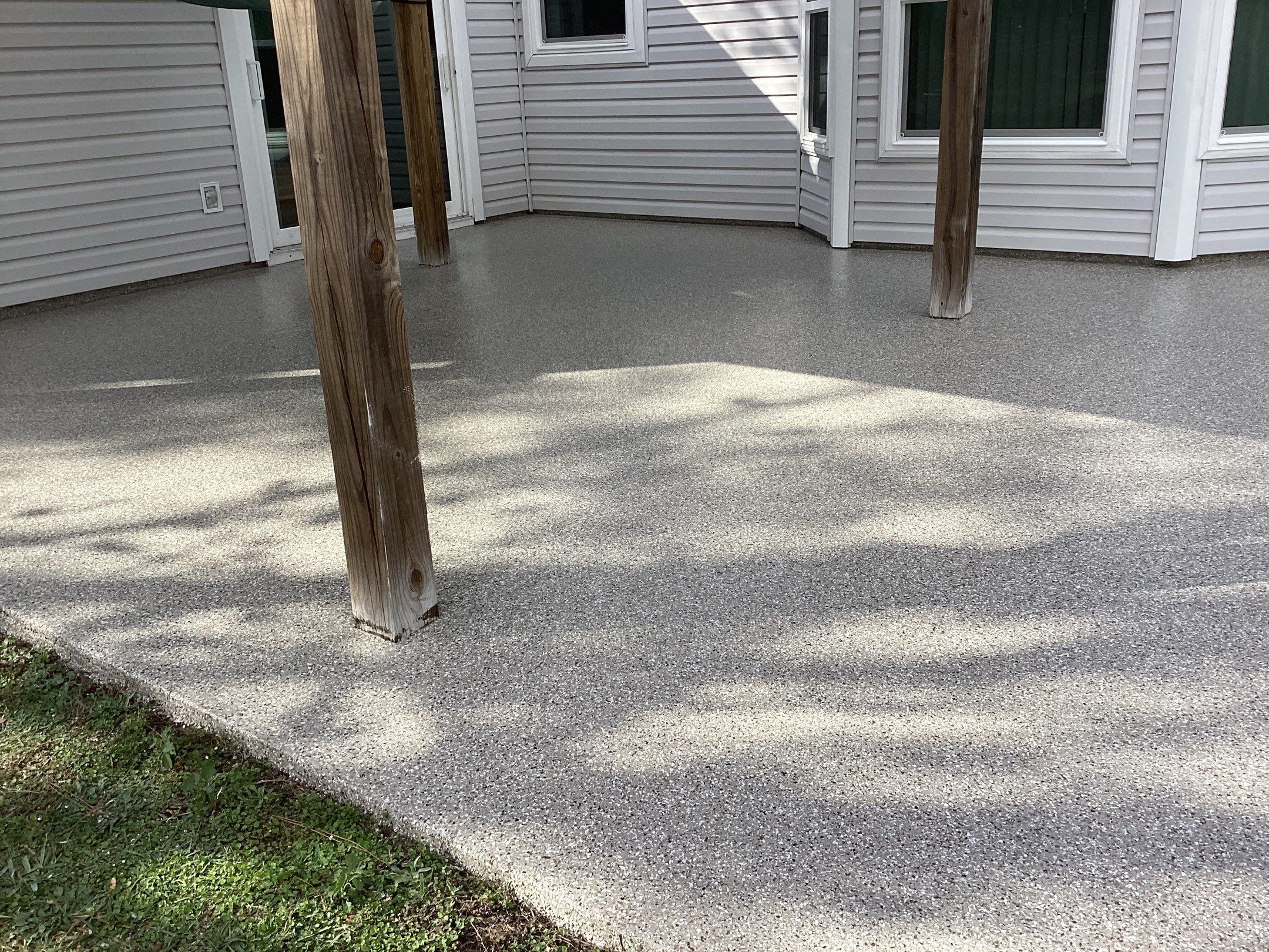 Patio using Pebble Beach by Amvet concrete coatings llc