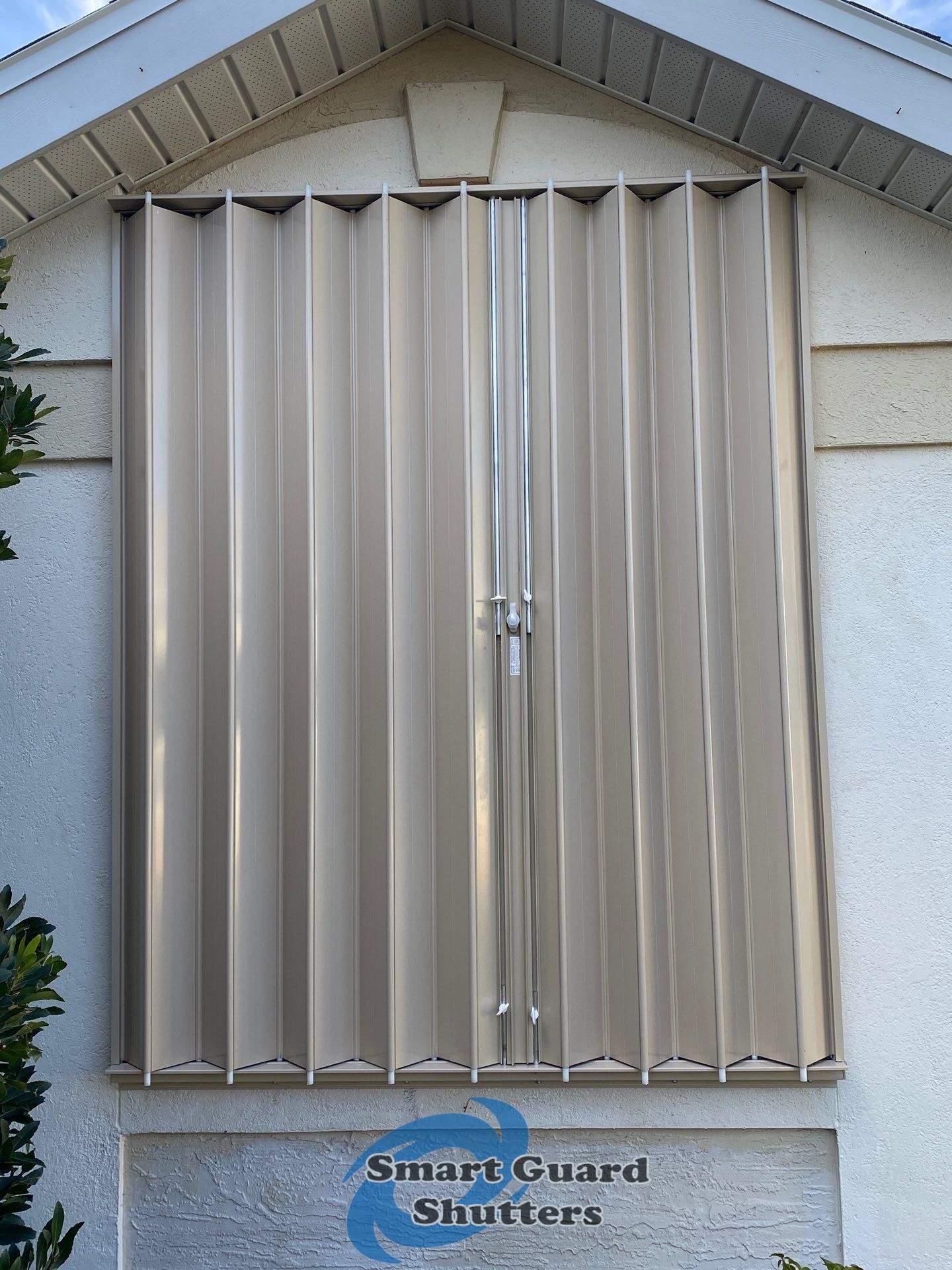 Accordion Shutters in Beige by Smart Guard Shutters