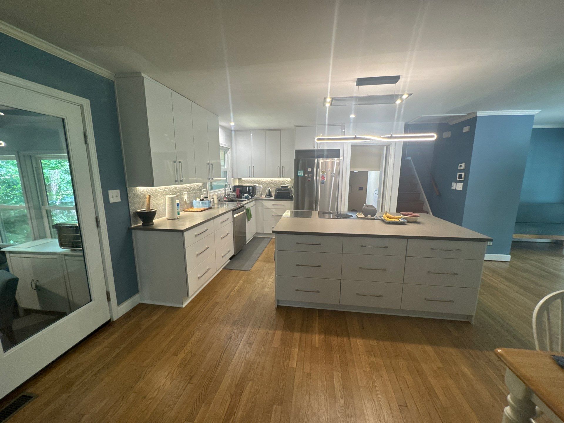 Modern Kitchen Remodeling with Large Central Island in Doraville by Swift Home Renovations