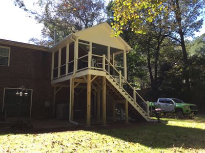 Elevated Screened Porch Addition With Gable Roof in Smyrna