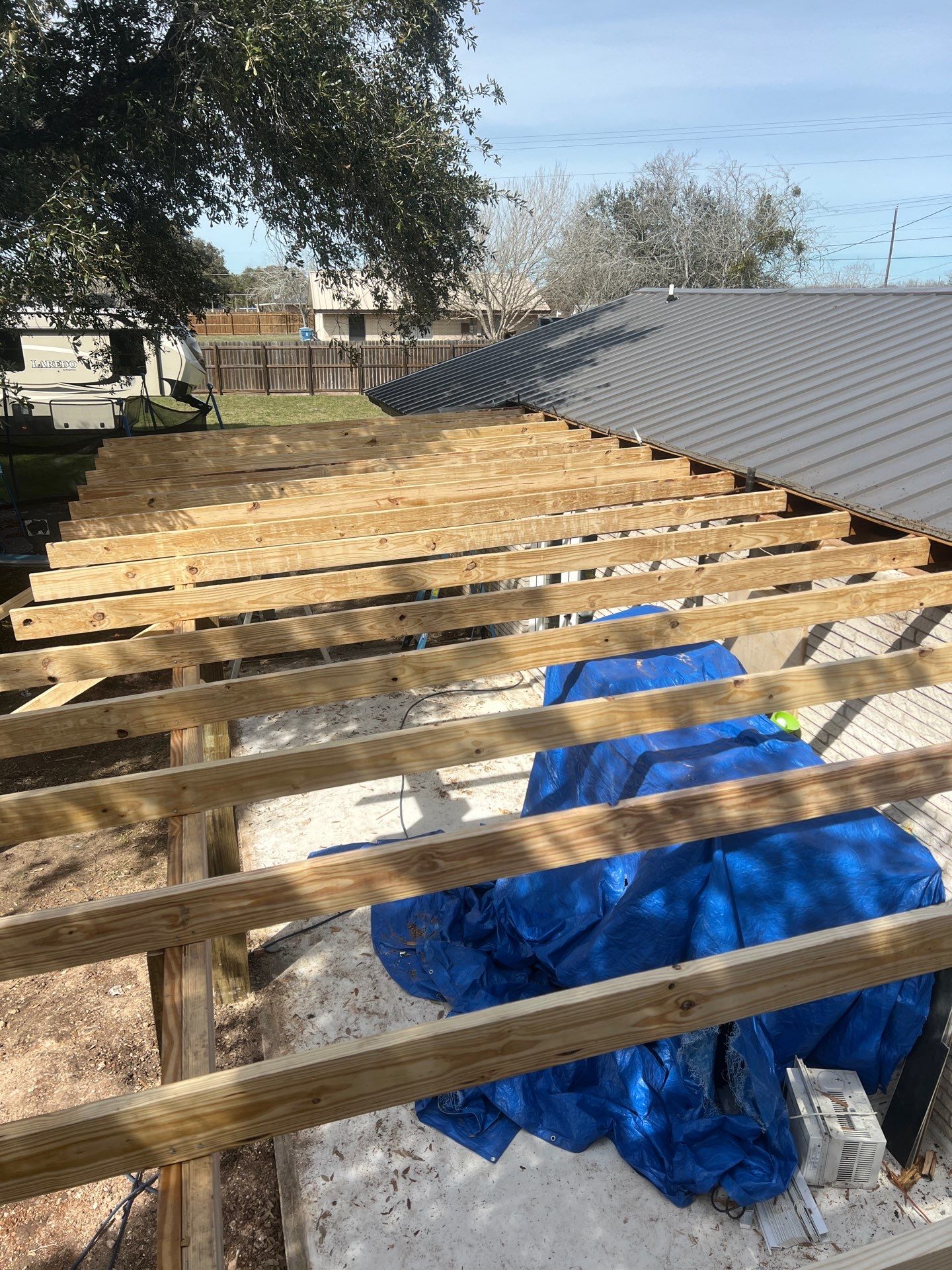 Patio? We got you Covered! by Bayfront Roofing and Construction