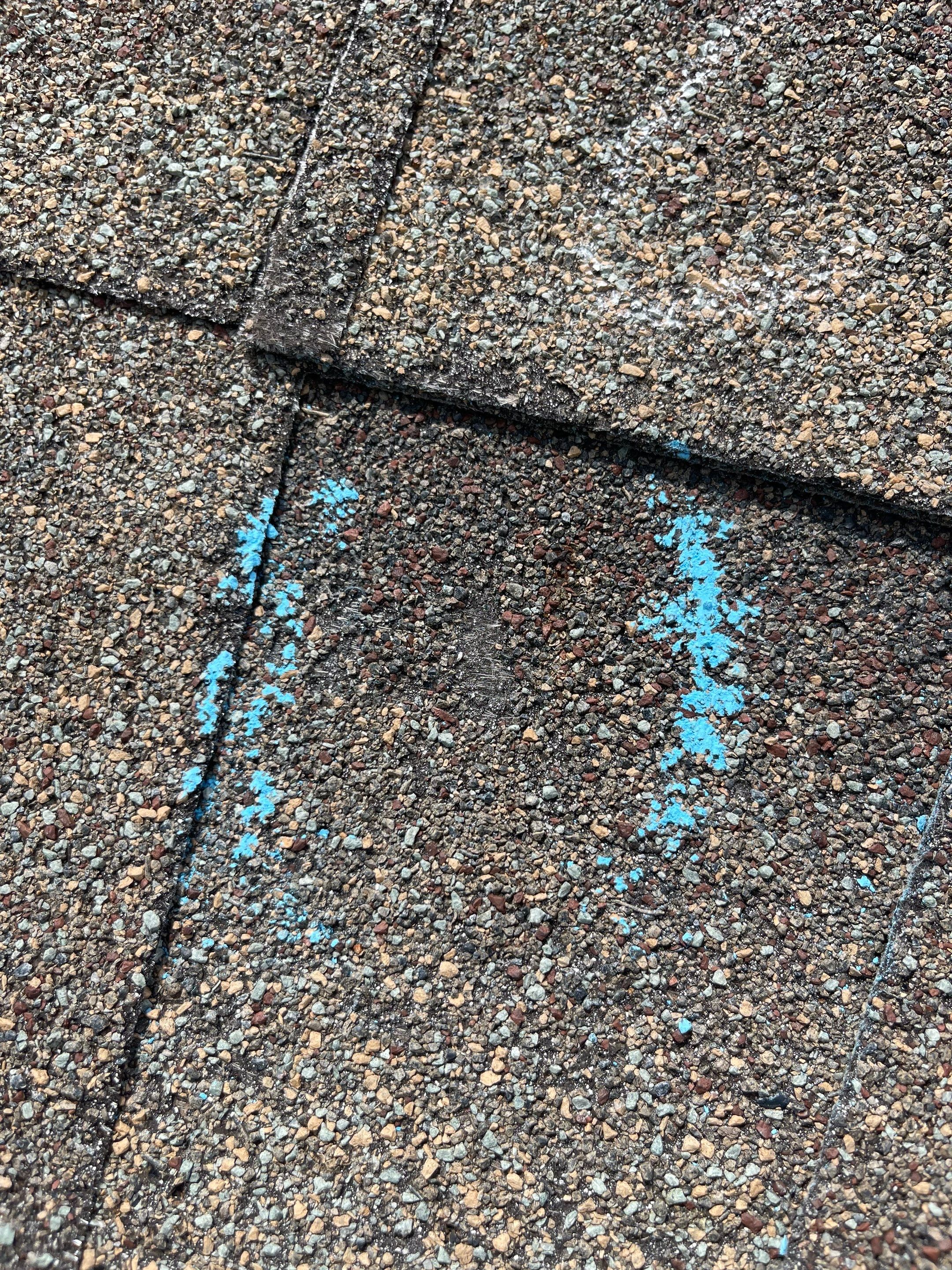 Hail Damage on a Roofing System by Icon Roofing And Construction 