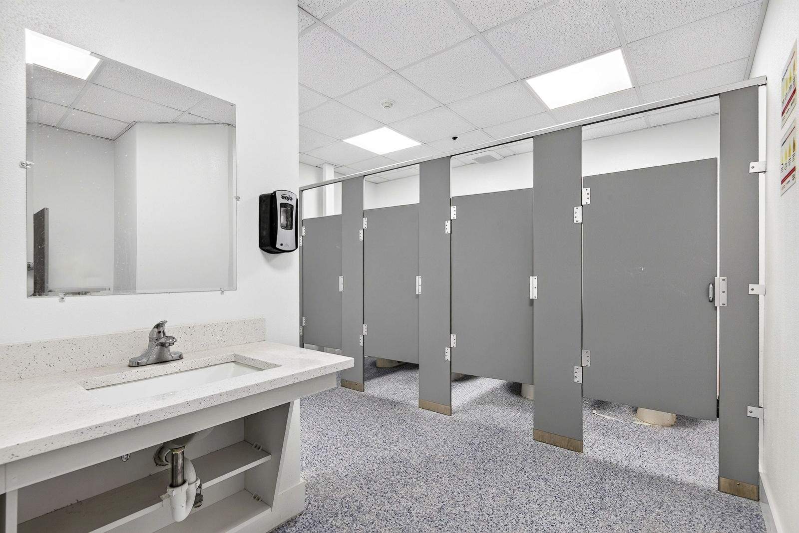 Commercial Restroom Renovation with Epoxy Flooring in Sarasota by Vertical General Contracting 