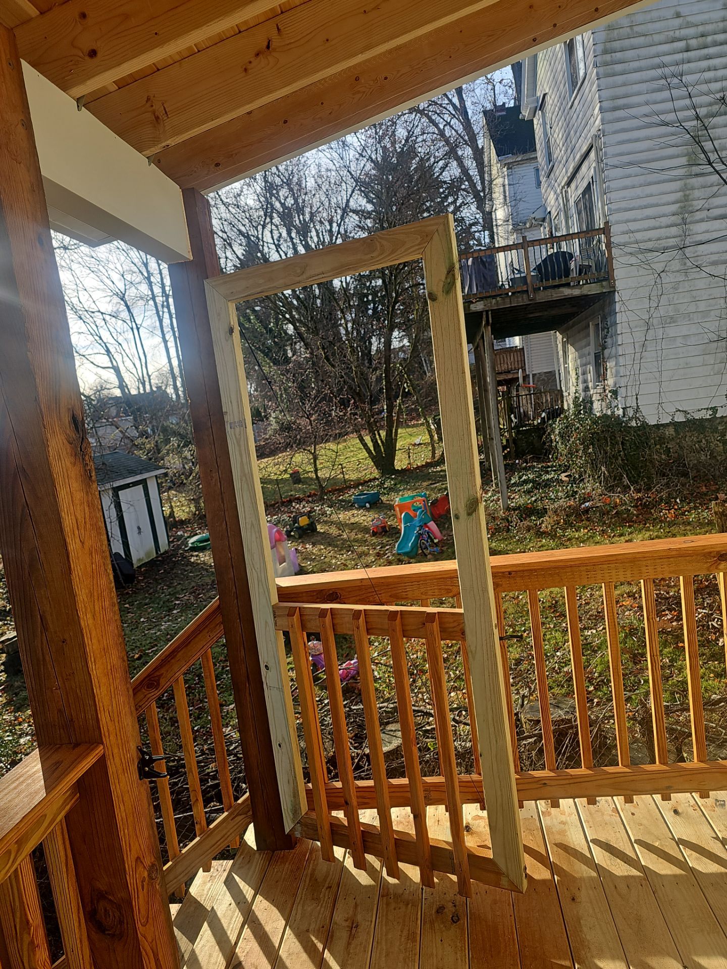 Deck and shed roof by Cousins Roofing Siding & Decks