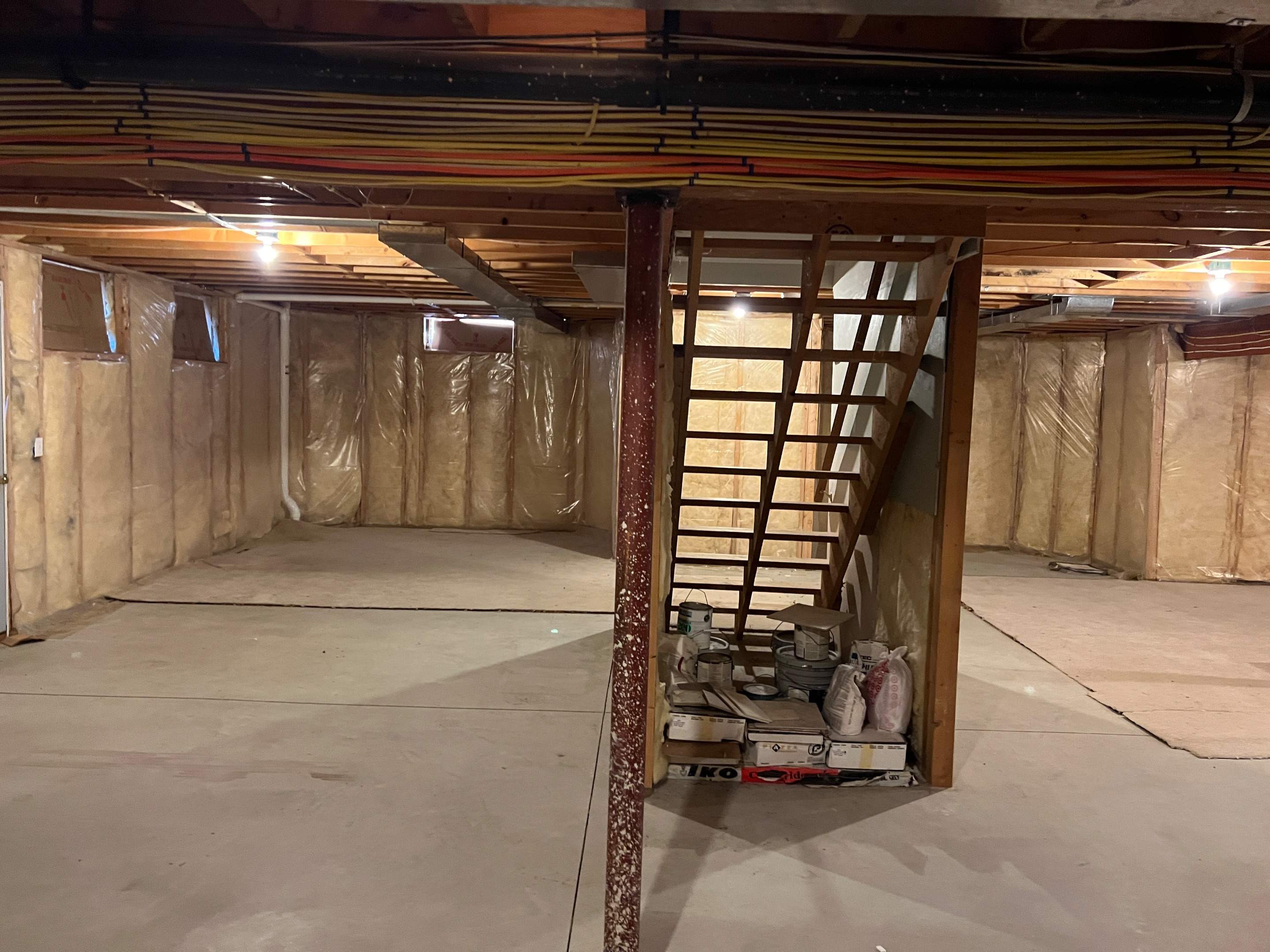 Basement Remodel w/ LVP Flooring & Exposed Ceiling by Chagnon Building & Remodeling LLC