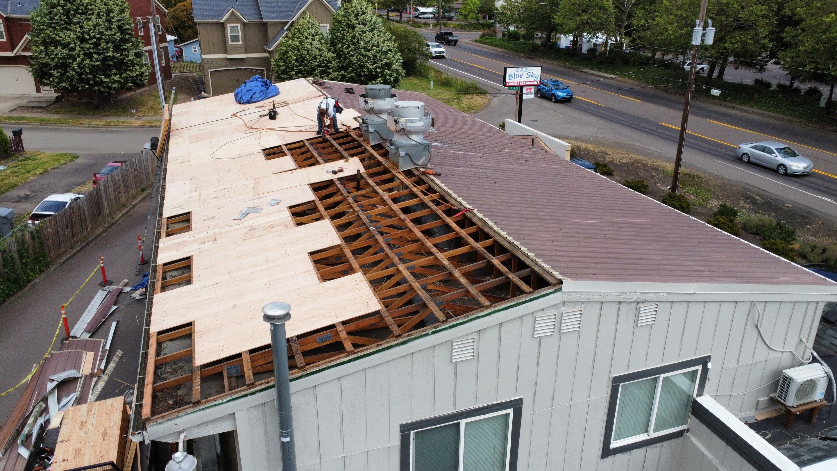 Commercial Flat Roof Installation using Bruce and Dana Snap Lock Metal (Color: Brown) by Orezona Building & Roofing Company, Inc.