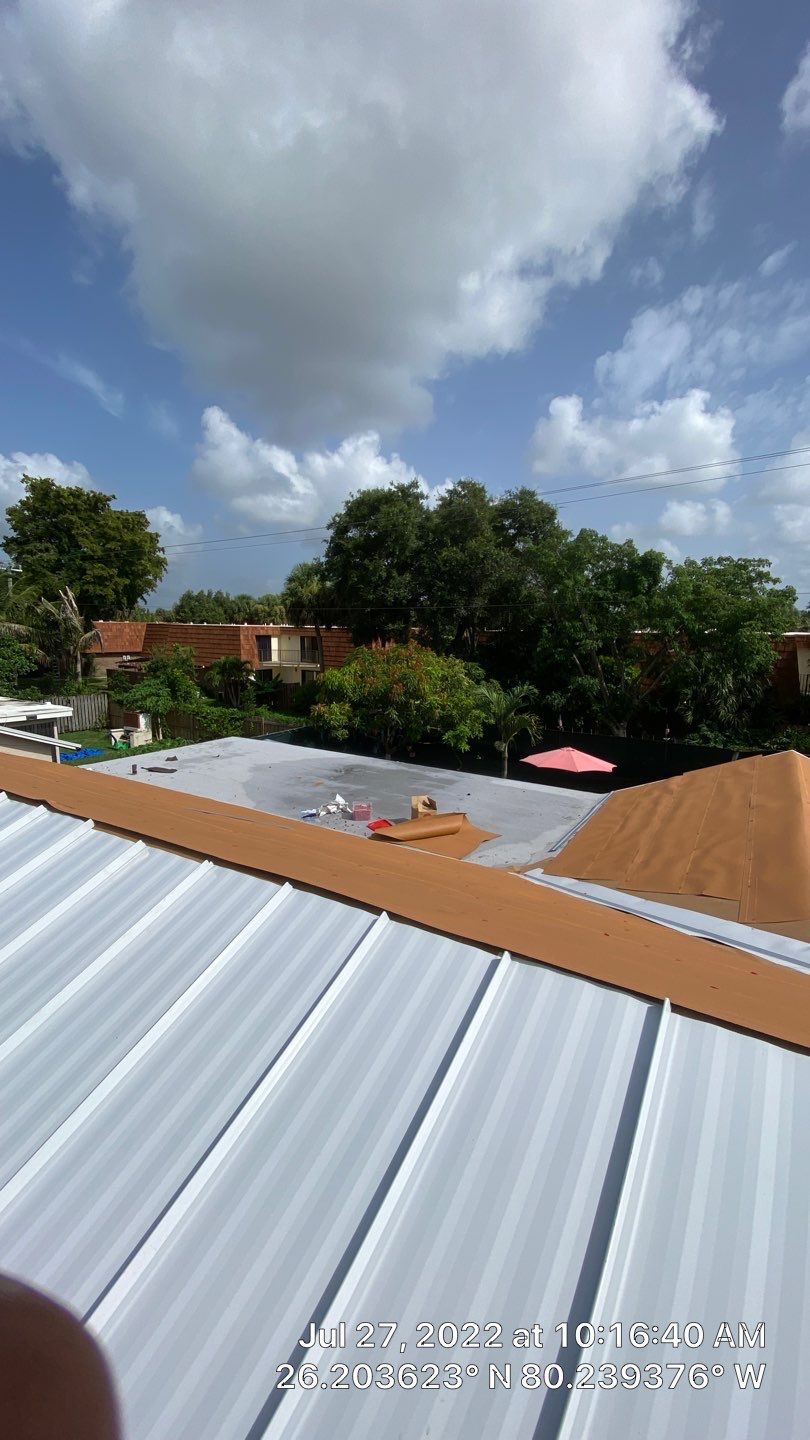 Residential Roofing Installation using 1.5" Nail Strip 24ga Solar White Kynar Coated Standing Seam Metal Panels by Morton Roofing, Inc.