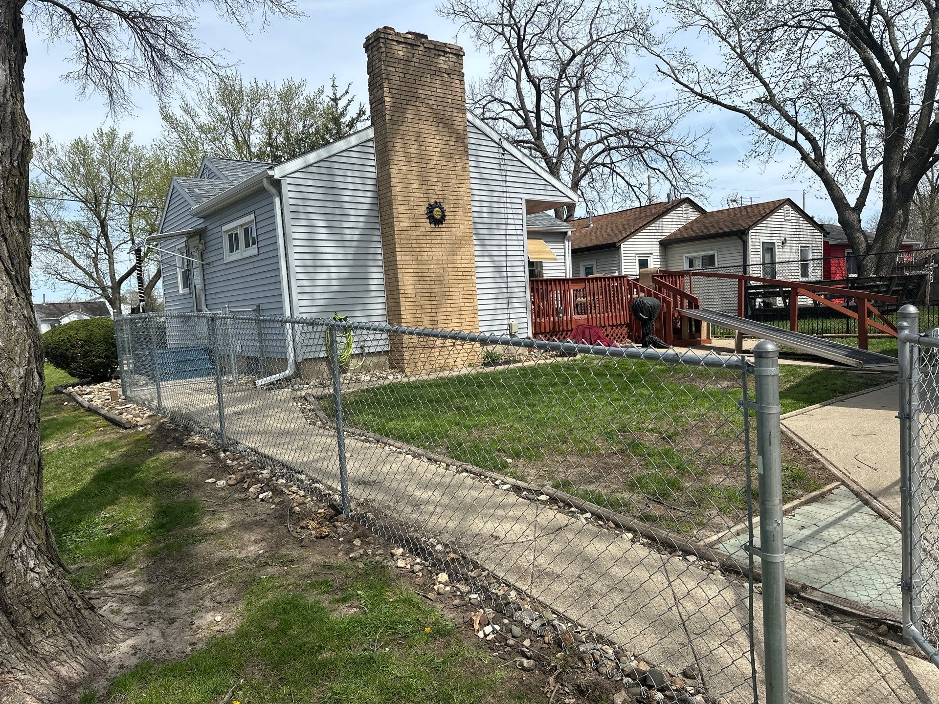 Black Chain Link Fence Installation for Waterloo Residential Backyard by Perfect Picket Fence and Stain