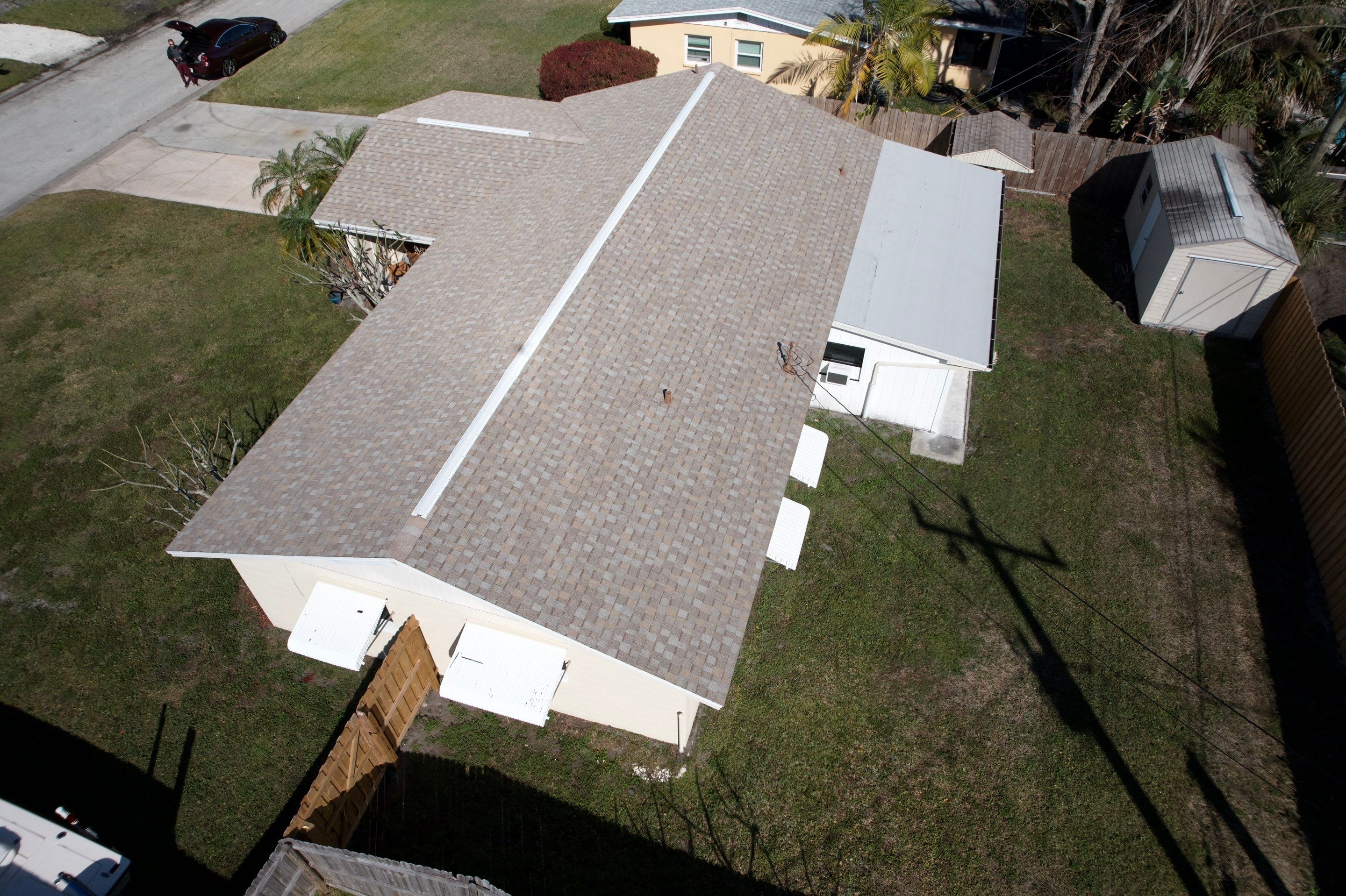 Complete Asphalt Shingle and Flat Roof Replacement in Merritt Island by Wiedmann Construction & Roofing