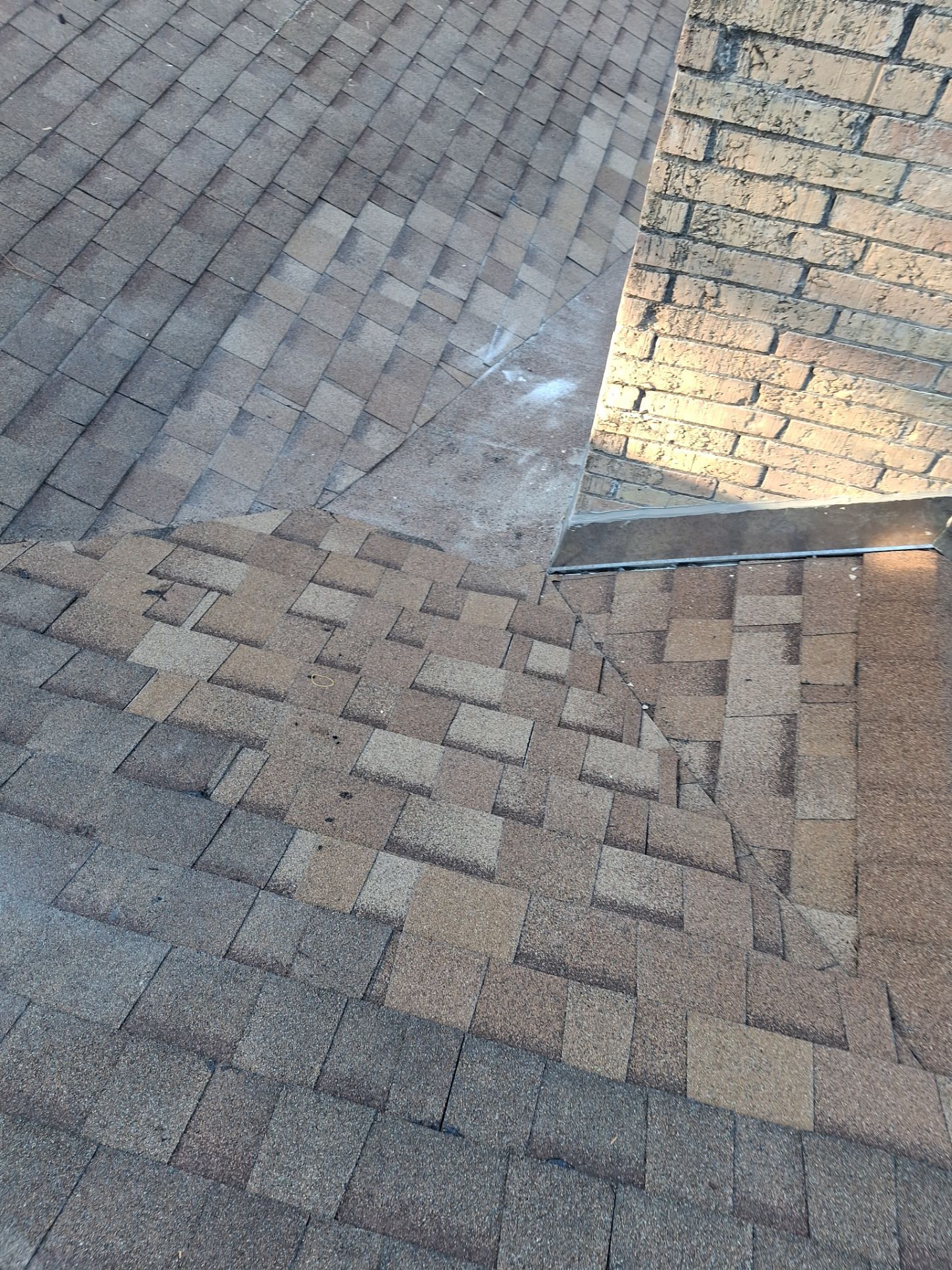 Chimneys need a Cricket.  by Bayfront Roofing and Construction