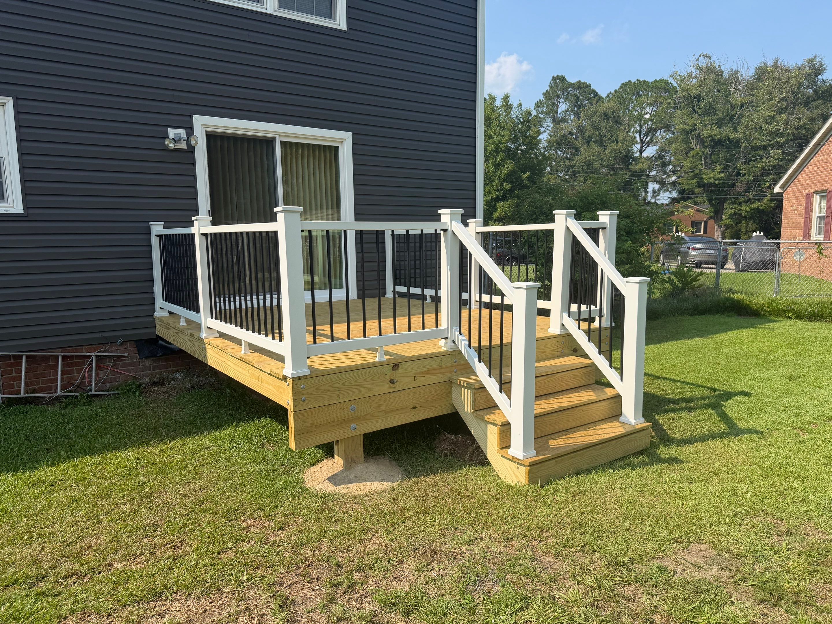 Dark Gray Siding and Custom Deck Installation in Kinston by The Remodeling Company
