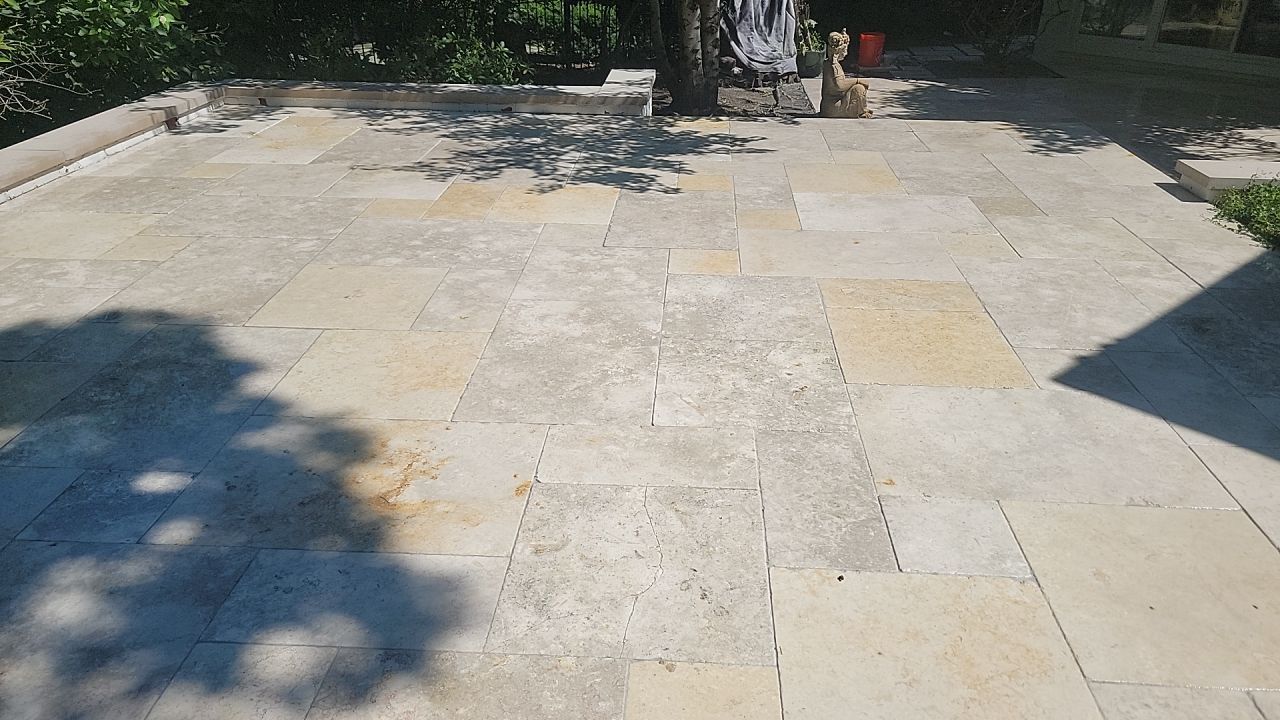 marble patio cleaning and sanding using Polysweep polymeric sand by Northern Power Washing LLC.