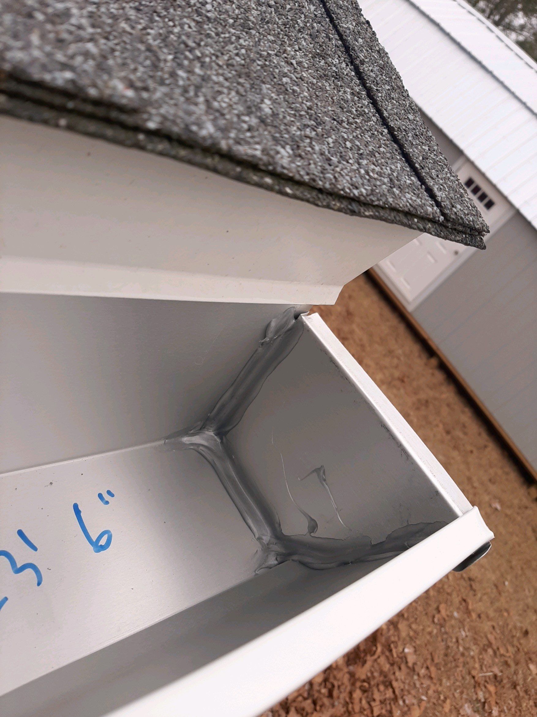 Gutter Installation using White Seamless Gutters by Gutter Professors