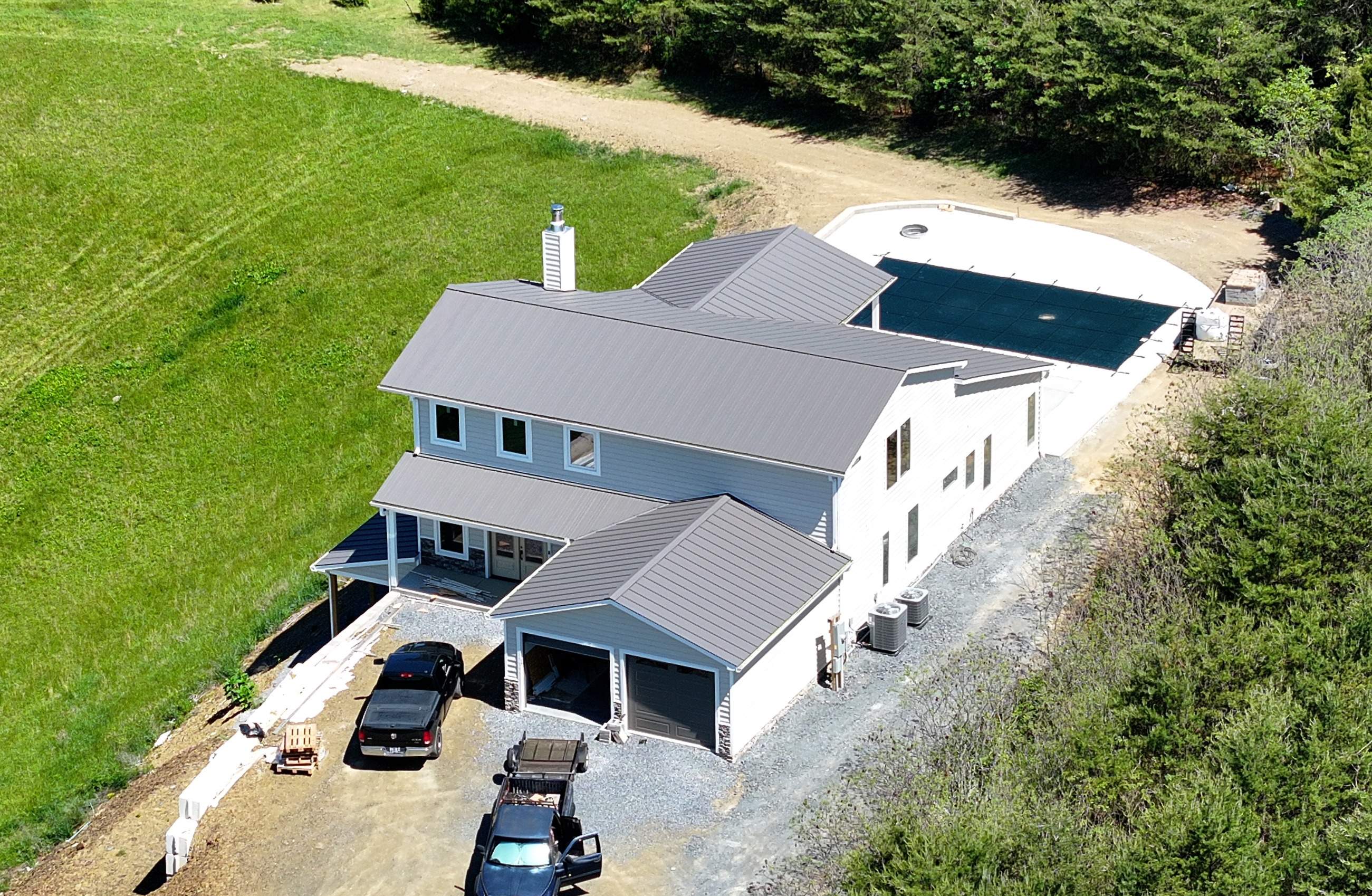 Textured Charcoal Gray Standing Seam by Omnia Roofing
