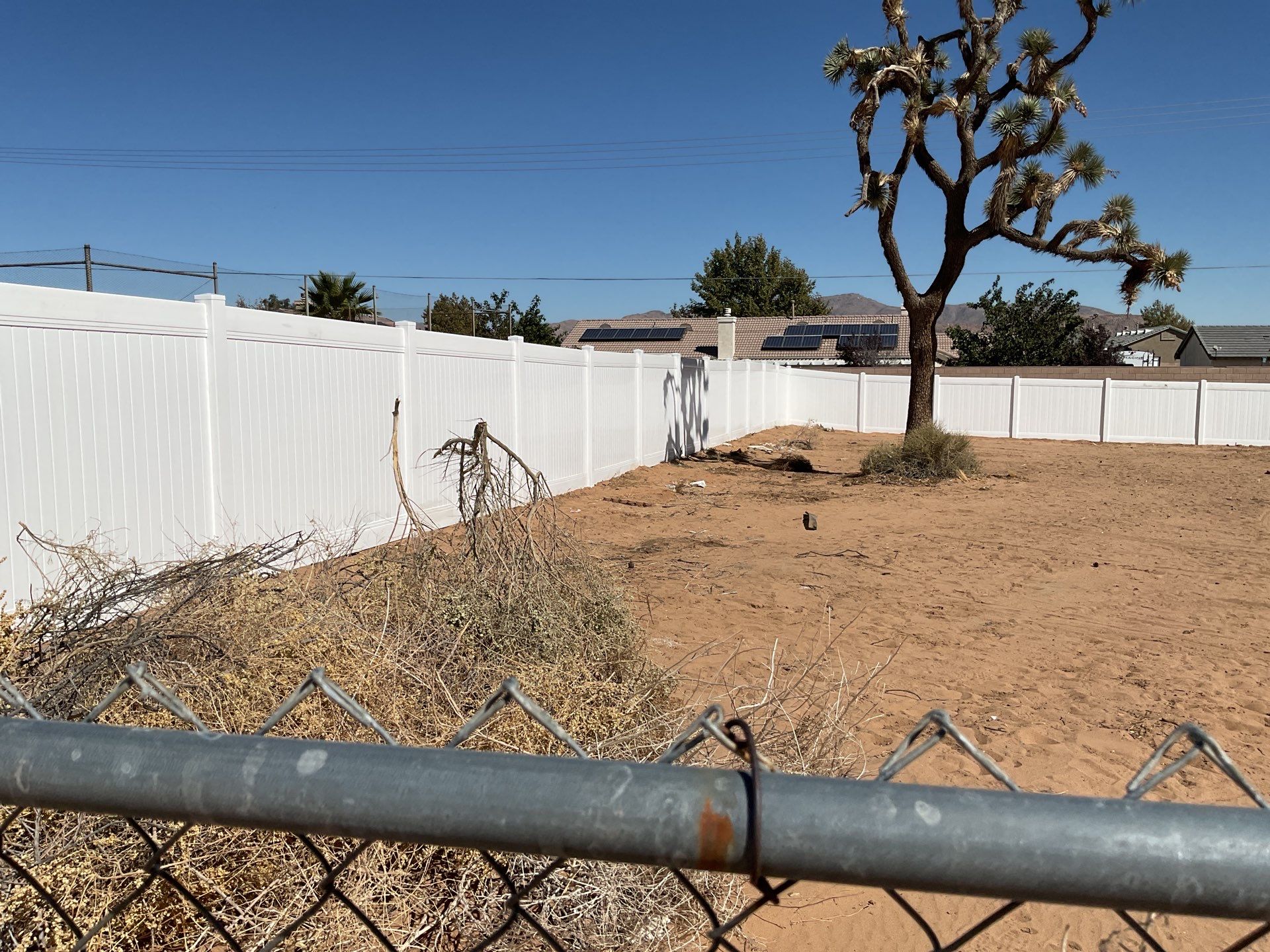 White picket fence  by Fence Guys Inc. 