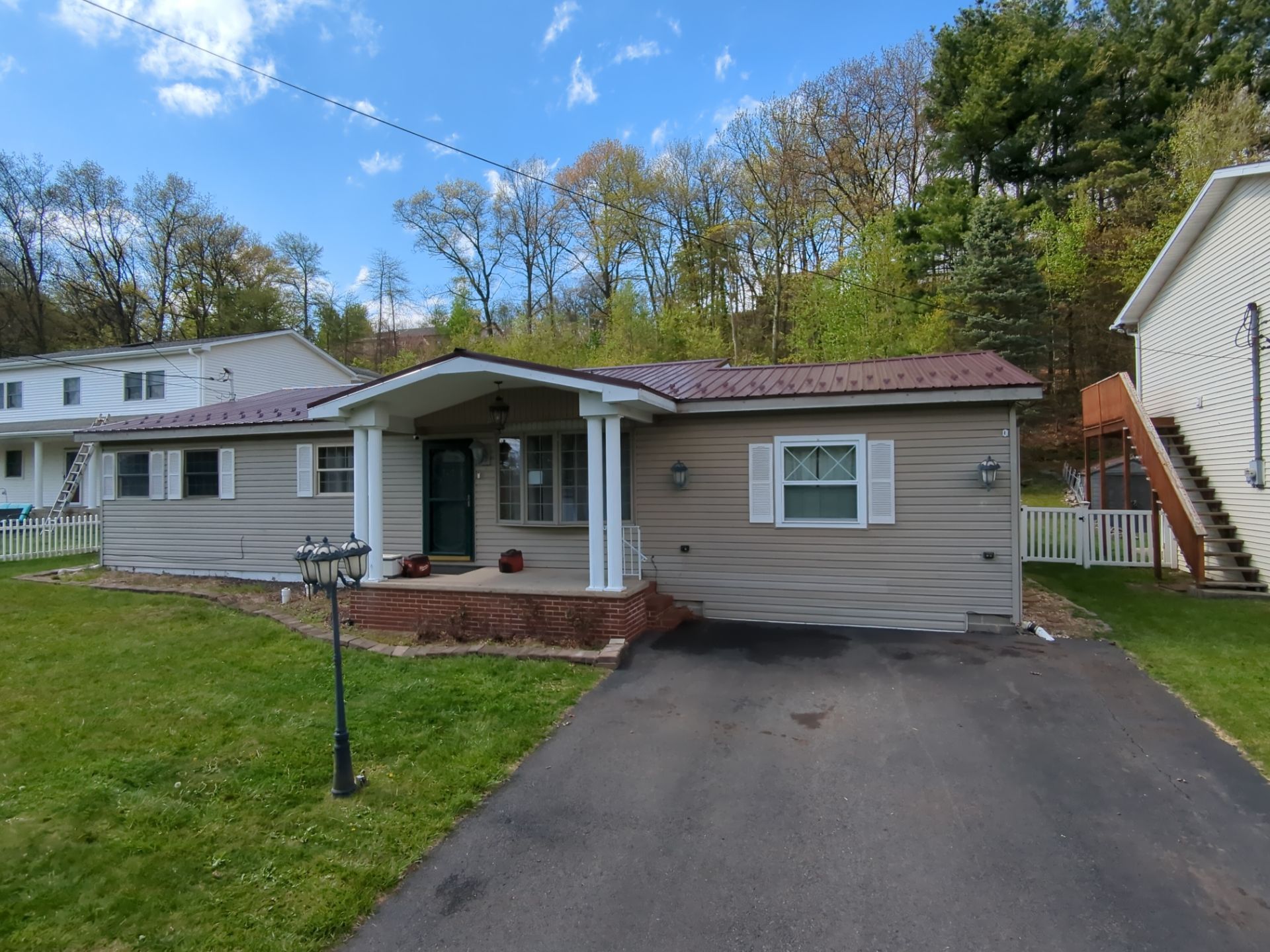 Maroon ABM Metal Roof Replacement and Gutter Installation in Shenandoah by Esh Builders