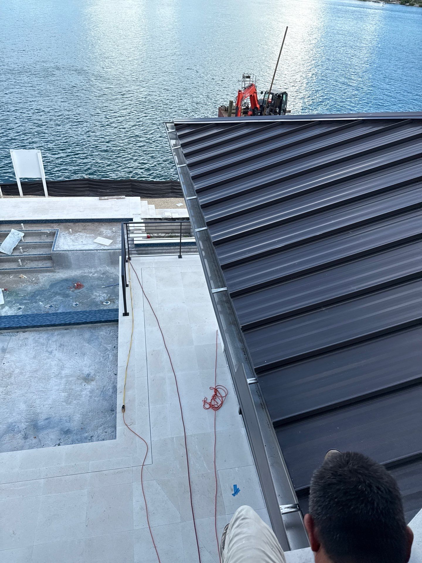 Seamless Aluminum Gutter Installation using black seamless gutters in Sarasota FL by Gutter Professors