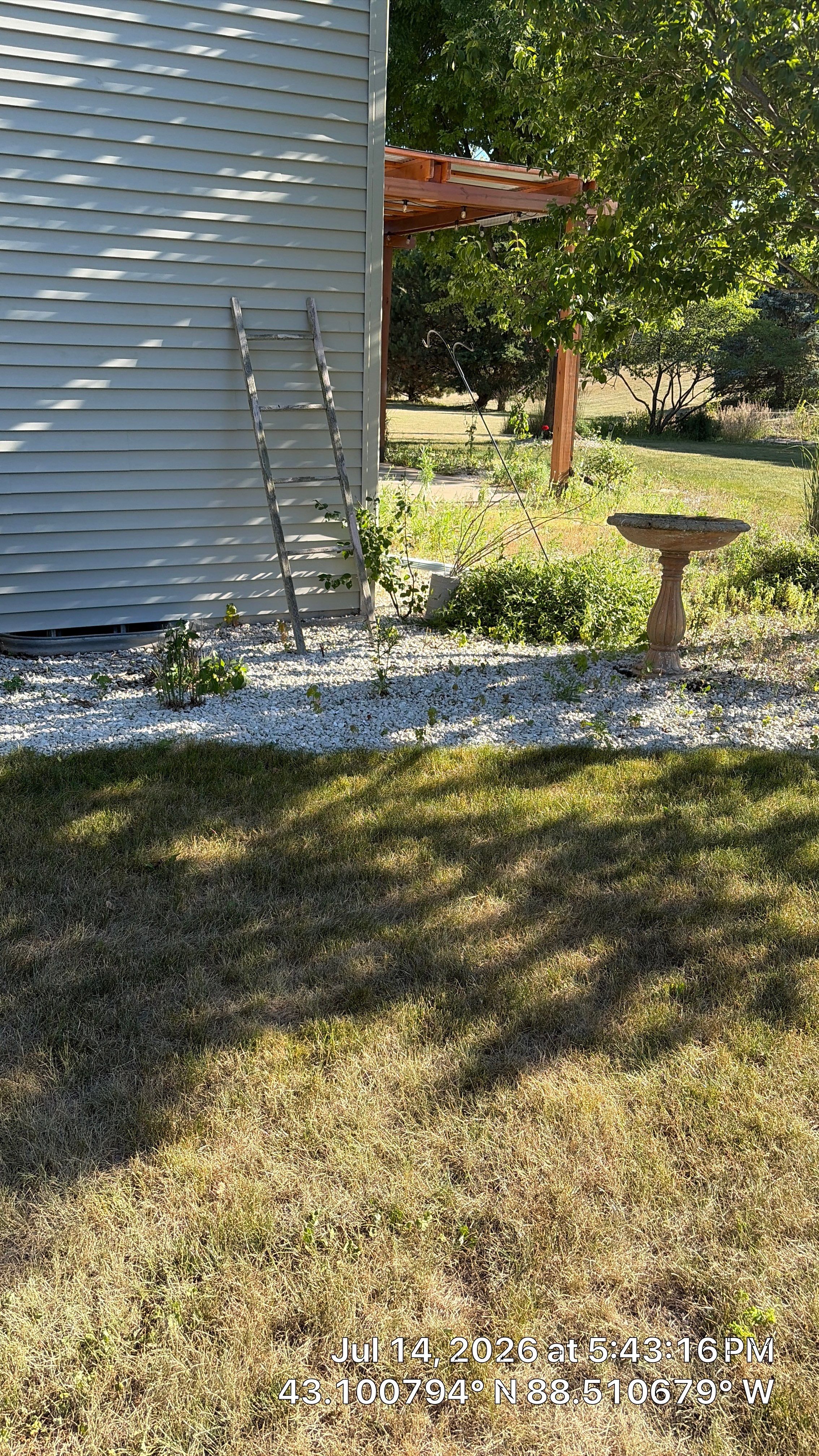 Decorative Stone and River Rock Landscaping for Oconomowoc Residence by CompanyCam Sales Demo