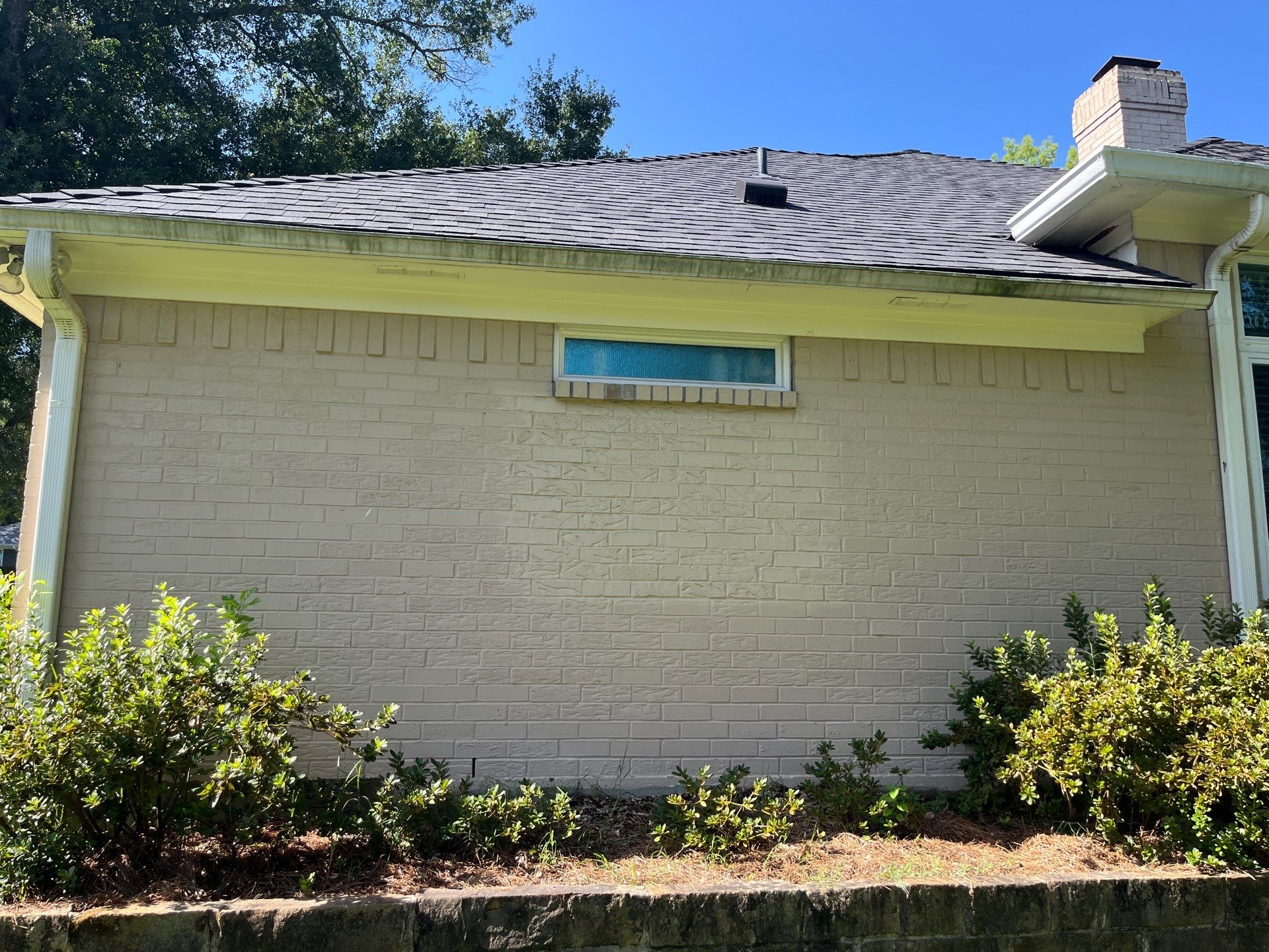 Exterior Painting in Tyler, TX | Brick House with White & Blue Finish by Quality Coats Painting