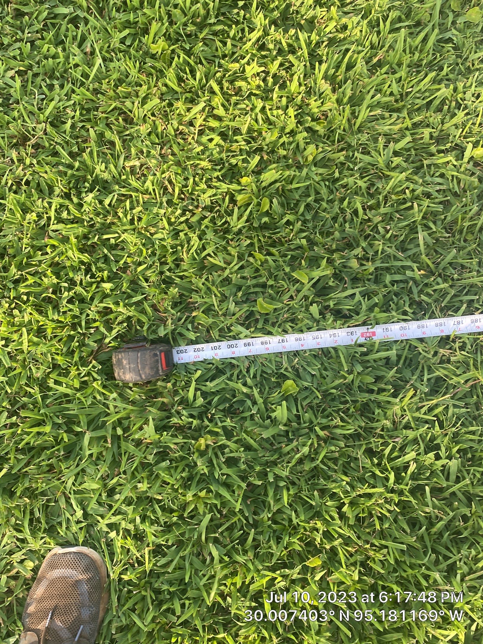 Complete metal driveway gate install with solar powered opener. Metal fence frame with Cedar Pickets by Astro Outdoor Designs 