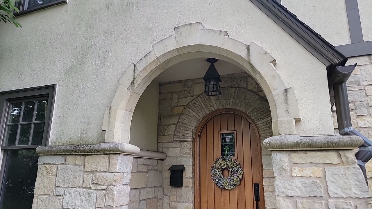 Northbrook, IL stucco home soft wash and stone cleaning by Northern Power Washing LLC.