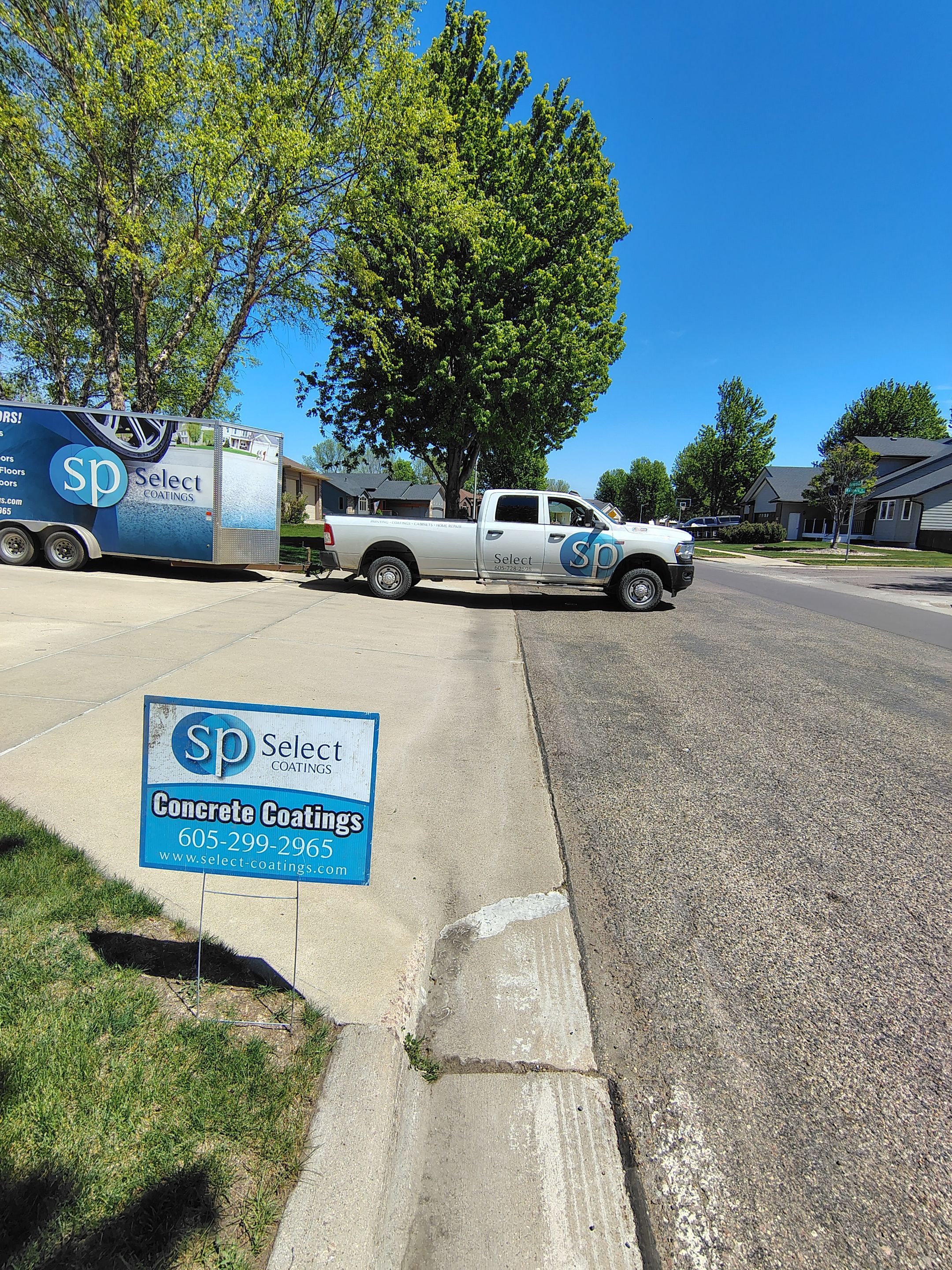 Sioux Falls Garage Concrete Repair and Epoxy Flake Floor Coating by Select Painting, Coatings & Garage Cabinets