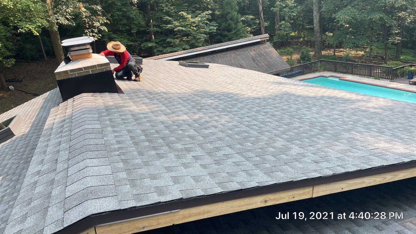 Deckhouse Roof Replacement by American Home Contractors