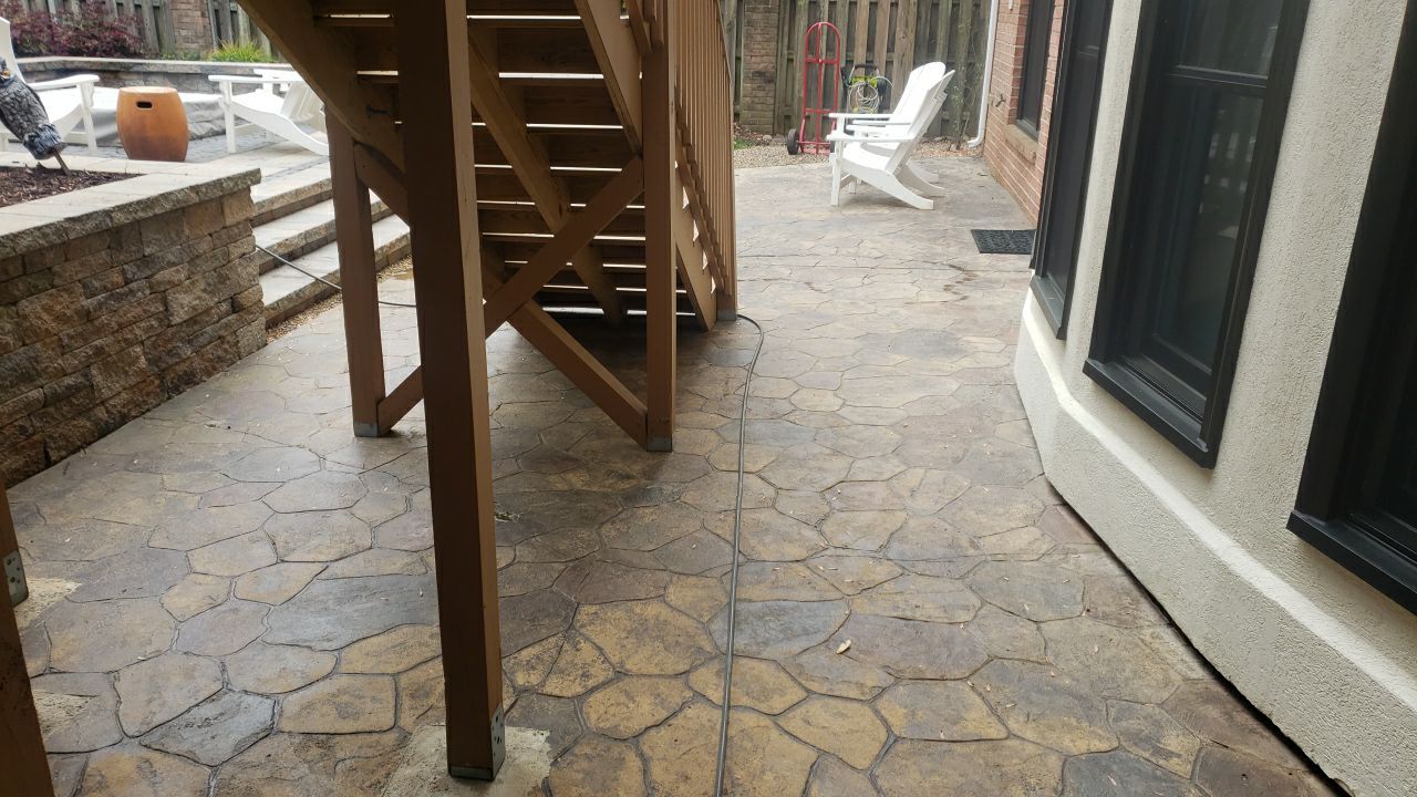 patio cleaning using cleaner by Power Wash Masters LLC