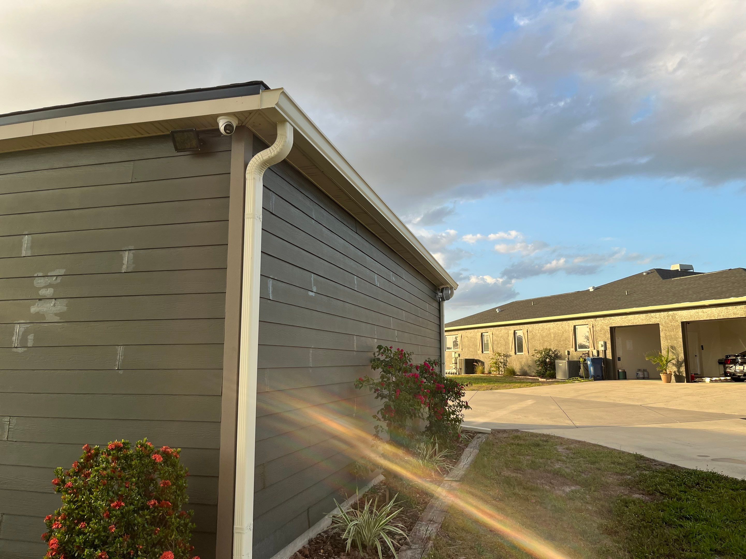  7-inch White seamless gutters and downspouts in Myakka City FL by Gutter Professors