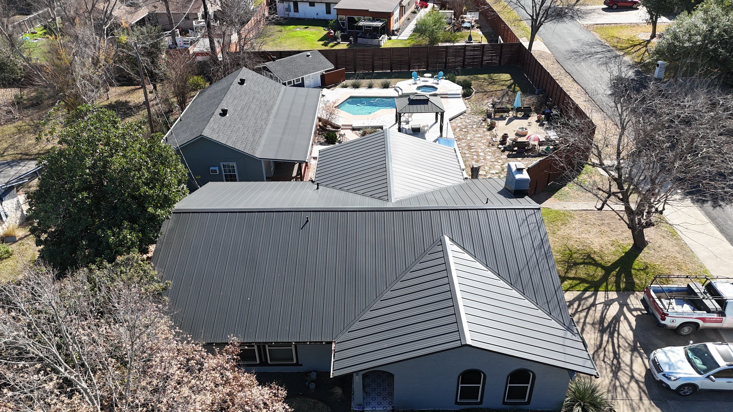 Residential Roof Replacement using Matte Black 24g by Action Exteriors Austin