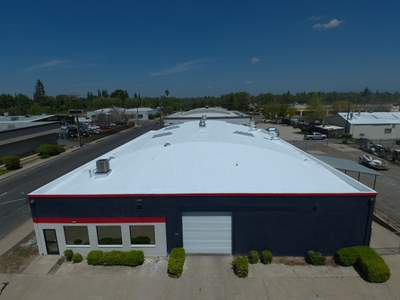 Spray foam and coatings using Conklin Benchmark/PUMA XL coatings on Auto Body Shop