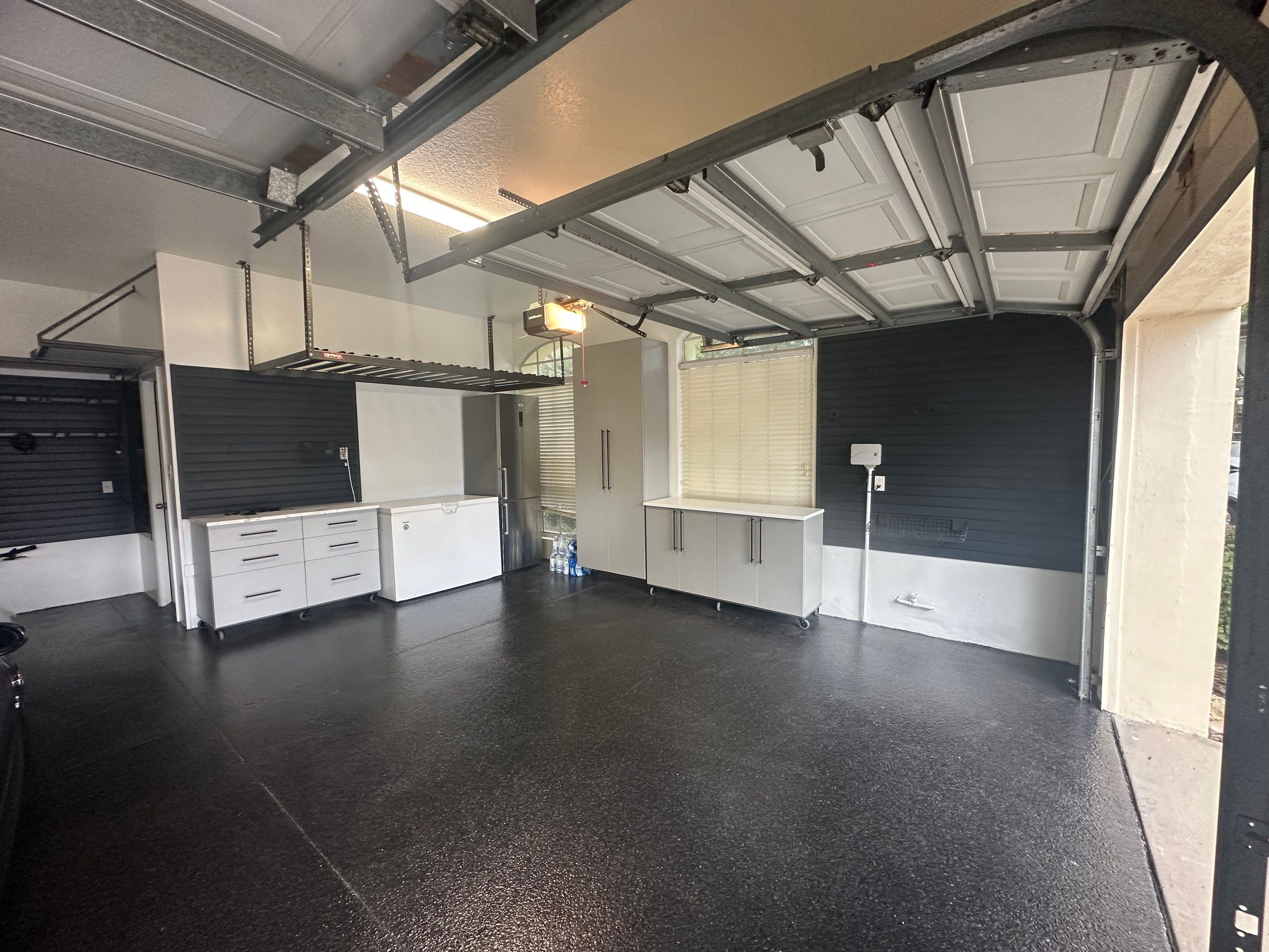 Tampa Garage Floor Coating and Overhead Storage Rack Installation by Square 1 Garage and Closet Solutions