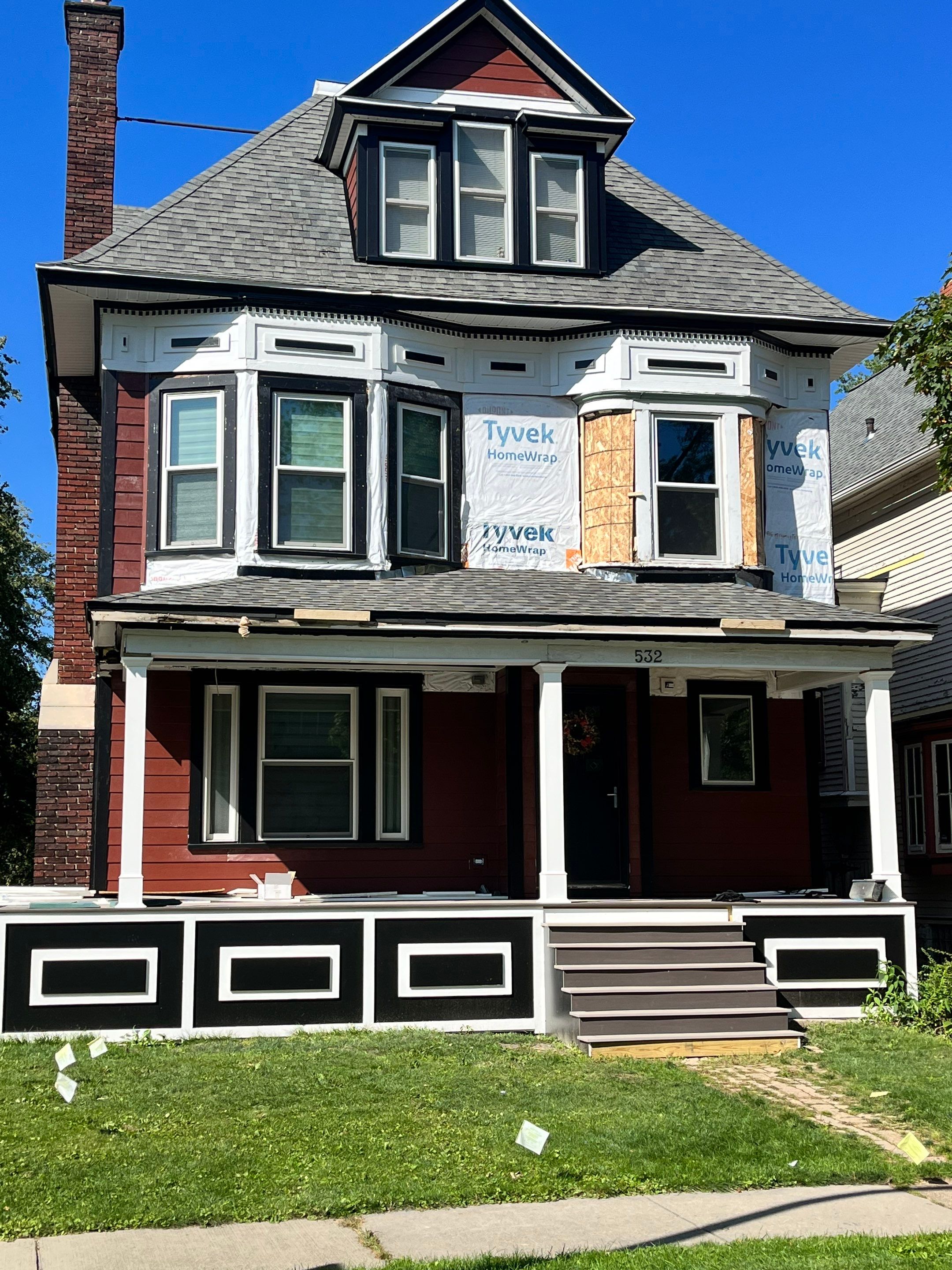 Exterior Renovations- Siding, Stamped Concrete, Porch, and Railings by Ivy Lea Construction