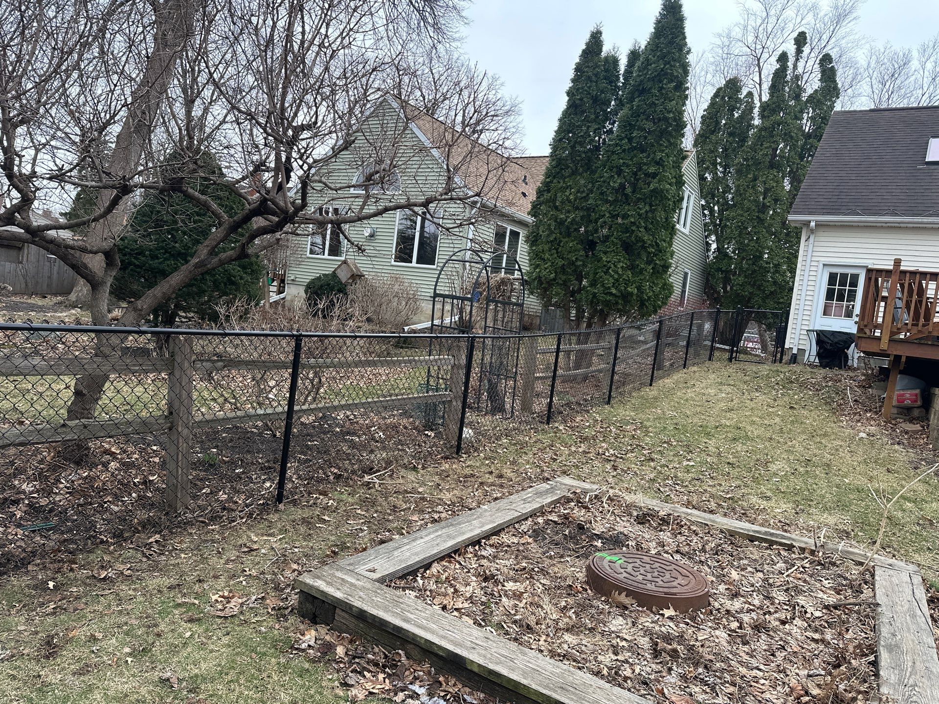 Black Vinyl Chain Link Fence Installation in Cedar Falls by Perfect Picket Fence and Stain