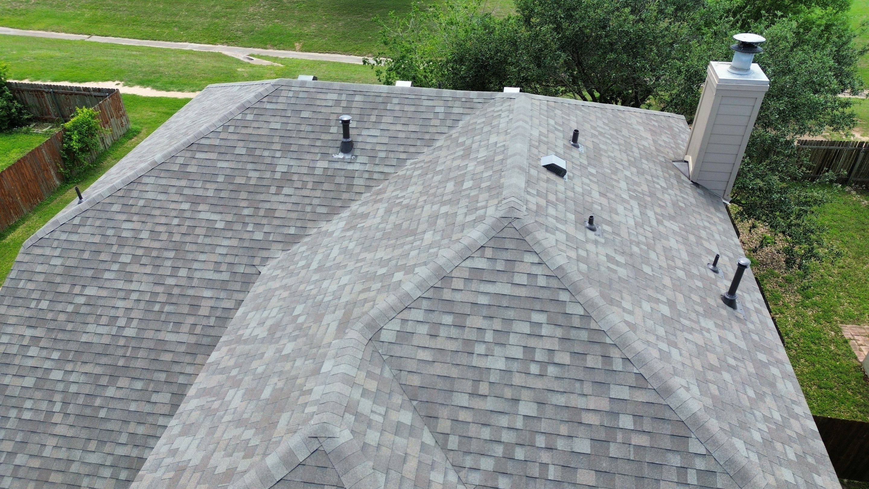 Roof Replacement & Chimney Cricket Upgrade in Cedar Park, TX by Kstylez Roofing & Construction