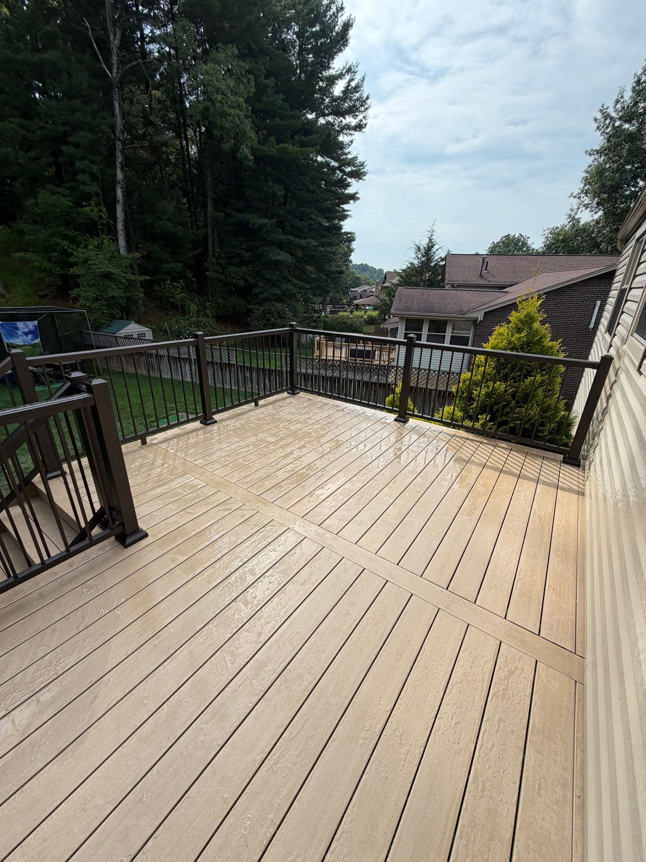Elevated Composite Deck Installation with Covered Porch in South Park Township by Cousins Roofing Siding & Decks