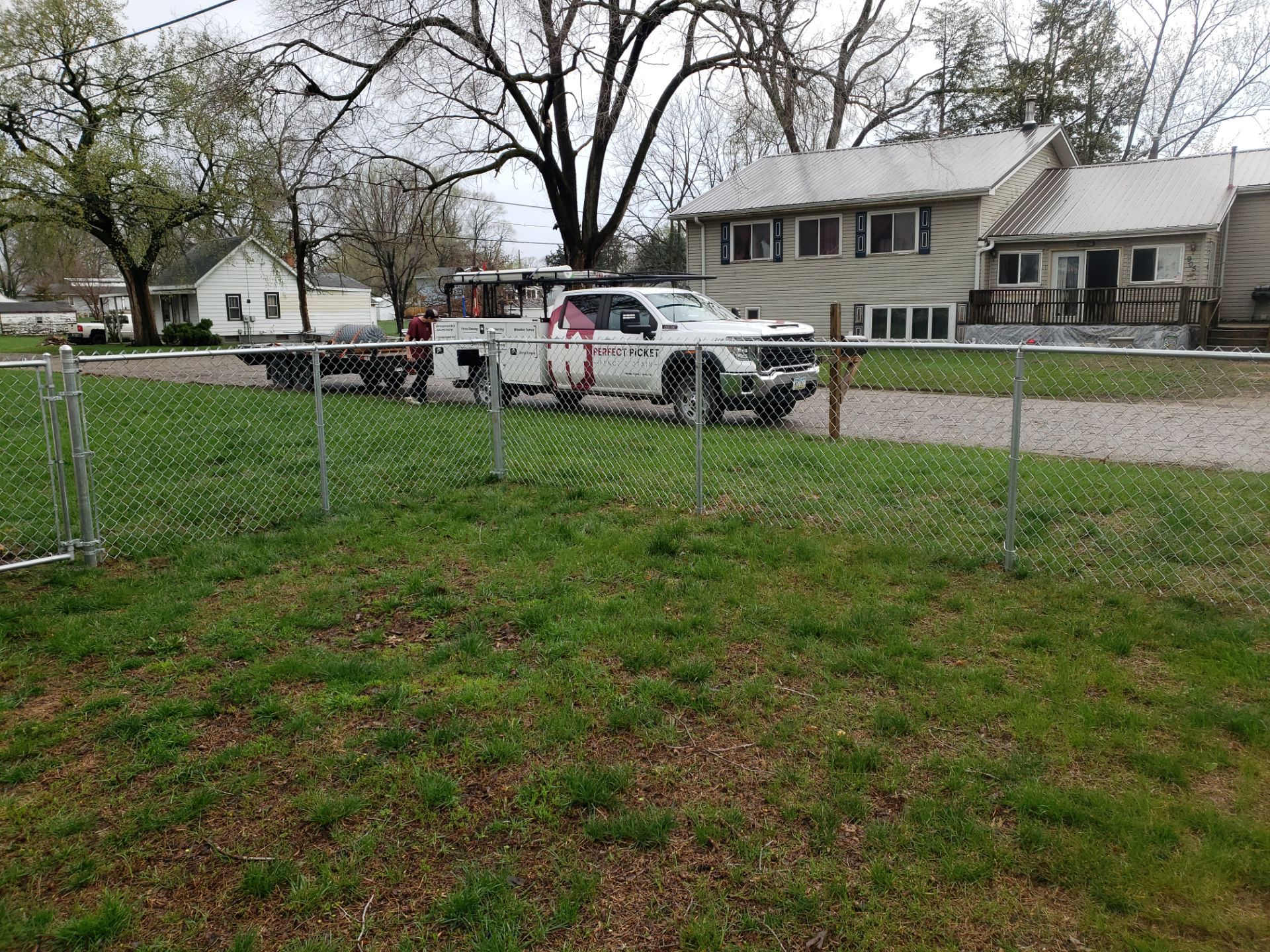 Galvanized Chain Link and Horizontal Wood Privacy Fencing in Waterloo by Perfect Picket Fence and Stain