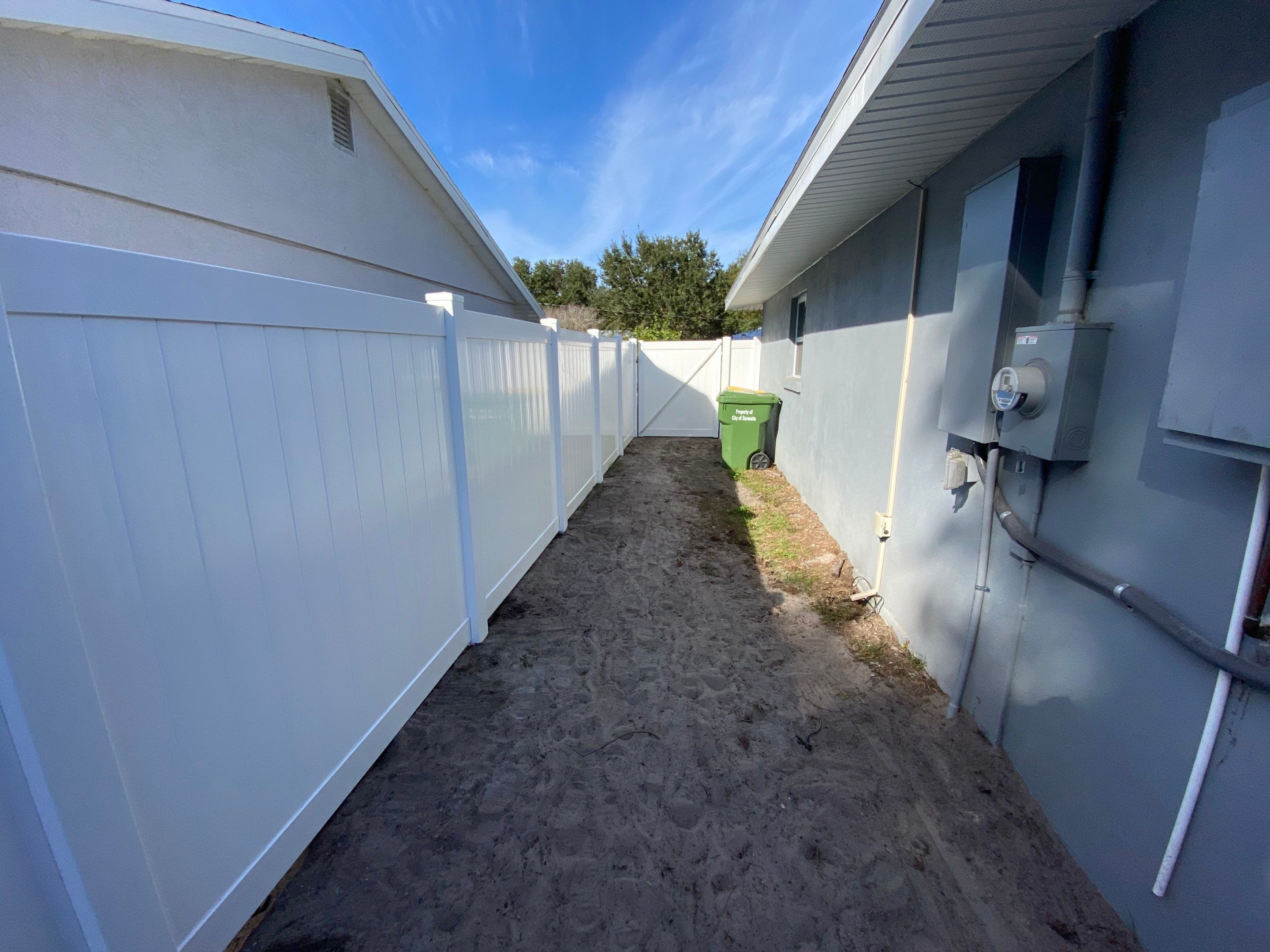 Vinyl Privacy Fence With AC Enclosure and Storage Corral by Asap fence and gates, LLC